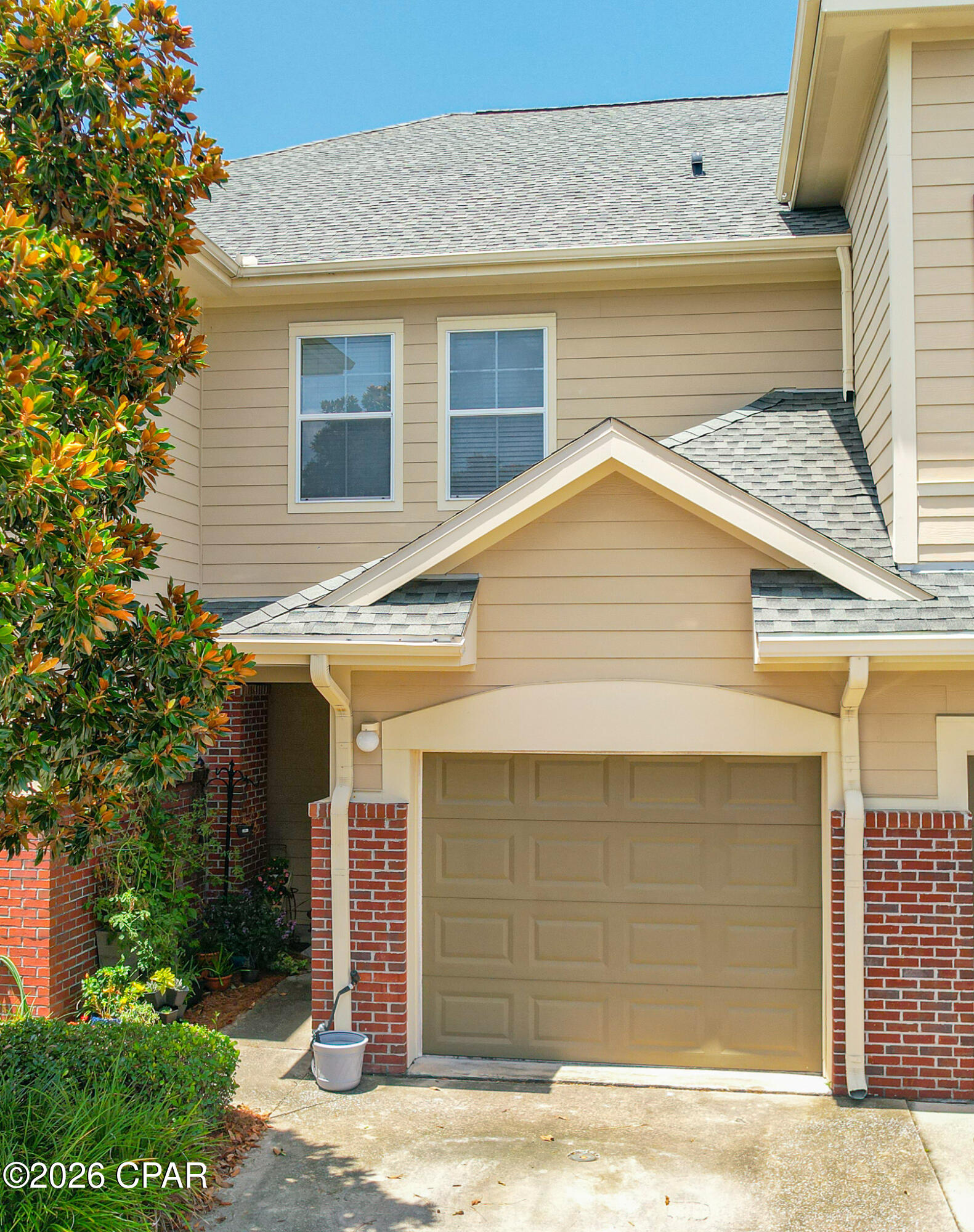 Welcome to this beautiful 2-bedroom, 2.5-bath townhome in the highly desirable gated community of Baldwin Rowe. Ideally positioned between Panama City and Lynn Haven, this inviting home offers convenient access to excellent schools, shopping, dining  and parks.

The bright, open-concept floor plan creates a comfortable setting for both everyday living and entertaining. The kitchen features a breakfast bar, generous cabinet and pantry storage. Hardwood flooring, crown molding, updated fans and lighting add warmth and character throughout the main living area, while the sliding glass door opens to a peaceful screened patio, an ideal place to enjoy your morning coffee or unwind at the end of the day.

Upstairs, both spacious bedrooms offer the privacy and convenience of their own bathrooms. The primary suite includes a private en suite bath, double vanity, walk-in closet, and thoughtful storage. A versatile loft or den provides additional space for a home office, reading area, or second living room, while the conveniently located upstairs laundry makes daily routines easier.

Baldwin Rowe offers an exceptional low-maintenance lifestyle with a community pool, large clubhouse, scenic ponds, nearby guest parking, and a courtesy officer living on the premises. The HOA includes lawn care, landscaping, trash service, maintenance of common areas, access to the pool and clubhouse, and more, allowing you to spend less time on upkeep and more time enjoying your home.

With its desirable location, attractive updates, flexible living space, and wonderful community amenities, this townhome is one you will not want to miss. The seller is motivated, so contact your Realtor today to schedule a private showing.

All information and measurements are approximate and should be verified if important.