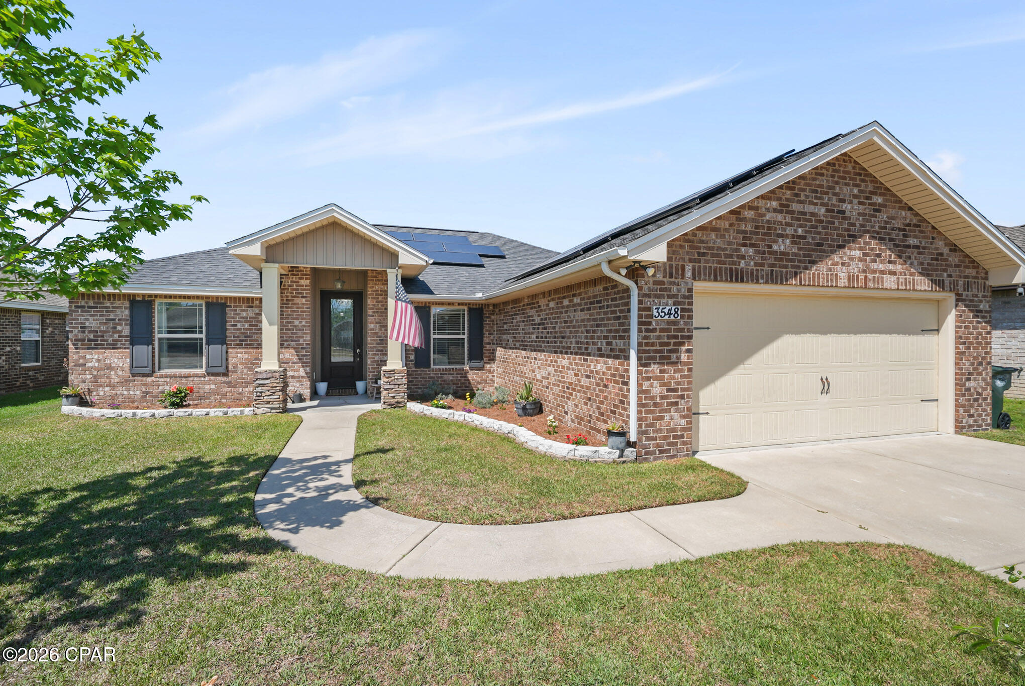 PRICED FOR A QUICK SALE! Located in the desirable Azalea Place subdivision in Lynn Haven, this all brick home offers convenient access to schools, main shopping areas, Tyndall Air Force Base, and the Naval Coastal Systems Base. This home is less an 10 miles to Downtown Panama City and approximately 15 miles to the emerald shores of Panama City Beach. 

Inside, the home features an open living and dining layout designed for both everyday living and entertaining. The living room is anchored by a fireplace, creating a warm and inviting focal point. The kitchen is well equipped with granite countertops, custom cabinetry, stainless steel appliances, and a breakfast bar that adds additional seating and functionality. Durable wood look flooring runs throughout the main living areas, complemented by updated lighting, recessed lighting, crown molding, and detailed wall trim accents.

The split floorplan offers a secondary bedroom just off the primary suite, making it an ideal setup for a nursery, home office, or flex space while still maintaining separation from the rest of the home.The primary suite offers a tray ceiling, double vanities, a walk in closet, and a separate tub and shower for added comfort. A glass front door creates a beautiful first impression, while French doors lead to the screened back porch, extending your living space outdoors.

Exterior features include a two car garage, covered front porch, screened back porch, fully sodded yard with an irrigation system, and sidewalk frontage. The backyard includes fruit trees, adding both charm and function to the outdoor space. The home is also equipped with solar panels, offering potential energy efficiency benefits.

Contact a REALTOR today to schedule a private showing. Buyer to verify all measurements and information deemed important.