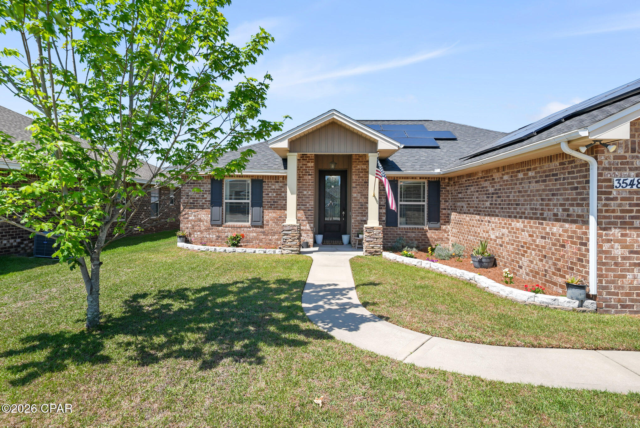 TURN KEY & PRICED BELOW MARKET FOR A QUICK SALE! 

WELCOME to Azalea Place subdivision where the HOA is only $500 a year! This all brick home offers convenient access to schools, churches, main shopping areas, Tyndall Air Force Base, and the Naval Coastal Systems Base. This home is less an 10 miles to Downtown Panama City and approximately 15 miles to the emerald shores of Panama City Beach. 

Inside, the home features an open living and dining layout designed for both everyday living and entertaining. The living room is anchored by a fireplace, creating a warm and inviting focal point. The kitchen is well equipped with granite countertops, custom cabinetry, stainless steel appliances, and a breakfast bar that adds additional seating and functionality. Durable wood look flooring runs throughout the main living areas, complemented by updated lighting, recessed lighting, crown molding, and detailed wall trim accents.

The split floorplan offers a secondary bedroom just off the primary suite, making it an ideal setup for a nursery, home office, or flex space while still maintaining separation from the rest of the home.The primary suite offers a tray ceiling, double vanities, a walk in closet, and a separate tub and shower for added comfort. A glass front door creates a beautiful first impression, while French doors lead to the screened back porch, extending your living space outdoors.

Exterior features include a two car garage, covered front porch, screened back porch, fully sodded privacy fenced yard with an irrigation system, and sidewalk frontage. The backyard includes fruit trees, adding both charm and function to the outdoor space. The solar panels cost the sellers approx. $35 a month with FPL,  offering potential energy efficiency benefits.

Contact a REALTOR today to schedule a private showing. Buyer to verify all measurements and information deemed important.