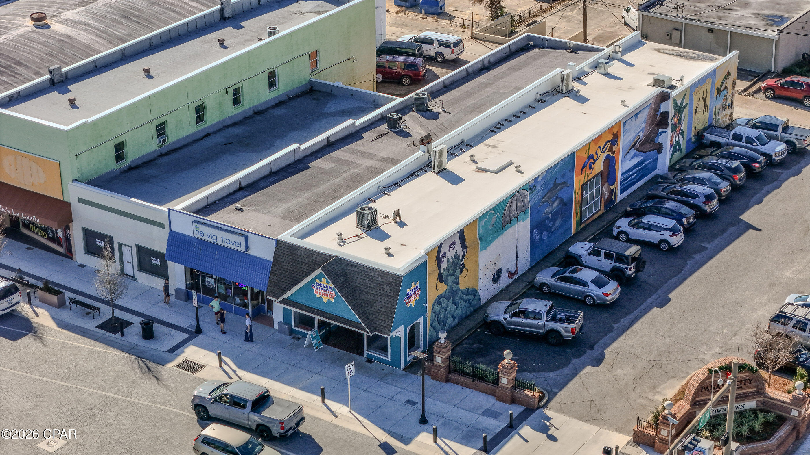 3500 Square feet of retail/restaurant/etc. space on the busy corner of Harrison and 6th Streets right where the bustling downtown starts! It's a beautiful brick building which currently has 8 murals by some of Panama City's best artists. Inside are natural brick walls in the first area as you walk in and painted white in the secondary area. There are two bathrooms, an office space (currently used and set up as a secondary kitchen), full kitchen with commercial vent hood, walk-in cooler and extra storage space with double doors leading to the alley for receiving freight. THIS LISTING IS FOR THE BUILDING ONLY.
 FF&E (Shelving/Coolers/Freezers/Tables & Chairs, etc.) are not part of the transaction but can be purchased as well. Kitchen hood and walk-in freezer are included since they are permanent and go through the ceiling/roof. This is a prime Opportunity Zone property and won't last long!
Seller is a Realtor
