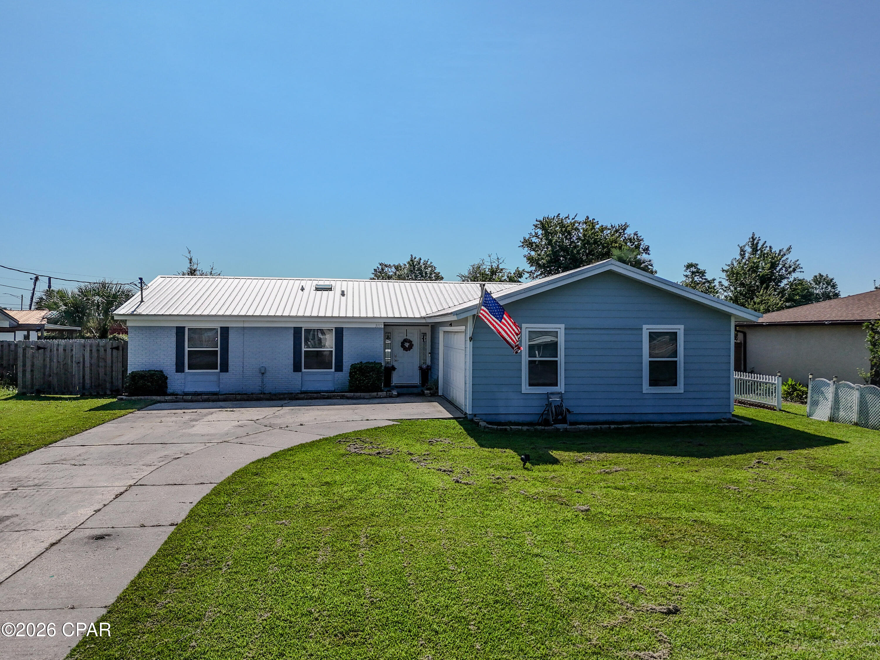 Welcome to 3117 Lawton Court--a move-in ready home tucked away on a spacious lot in one of Panama City's most convenient central locations. Whether you're commuting to work, heading to the beach, or enjoying everything Bay County has to offer, this location puts you right in the middle of it all.

Just around the corner from Sweet Bay, University Academy, parks, shopping, dining, medical facilities, and the newly expanded Highway 390 corridor, you'll enjoy quick access to both Panama City and Panama City Beach without sacrificing the comfort of an established neighborhood.

Inside, this well-maintained, move in ready 3-bedroom, 2-bath home offers a practical layout designed for everyday living. Plank tile flooring flows through the main living areas, while comfortable carpeting adds warmth to the bedrooms. Both bathrooms have been tastefully remodeled, creating fresh, updated spaces you'll appreciate from day one.

Major improvements have already been completed, which include plumbing updates, giving buyers added peace of mind. Even better, a survey, 4-Point Inspection, and Wind Mitigation Report are available --helping simplify the buying process and potentially saving on insurance costs.

Situated in Flood Zone X, this property offers the benefit of a large yard with room to relax, entertain, garden, or simply enjoy your own outdoor space.

If you've been searching for a well-cared-for home in a location that makes everyday life easier, this one deserves a spot at the top of your list.