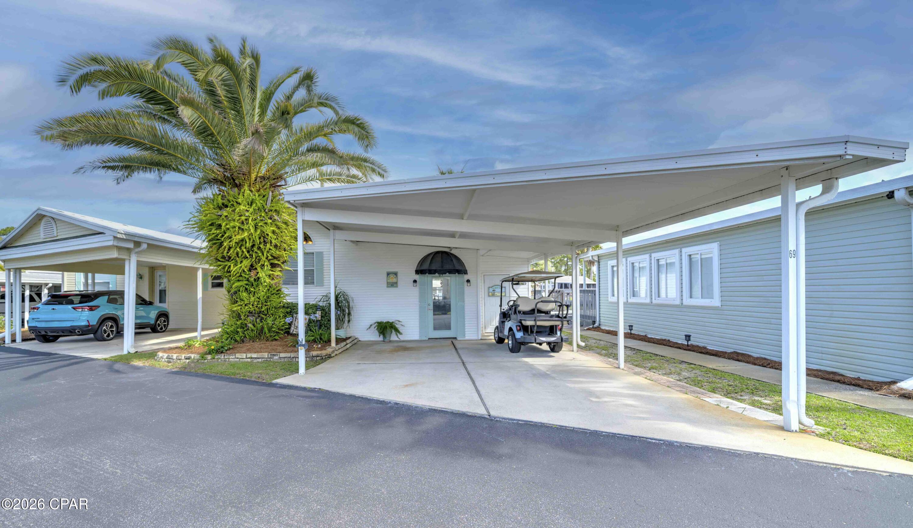 Experience the perfect getaway with stunning waterfront views! Take advantage of this chance to own an updated home in Emerald Pointe Resort, conveniently located near restaurants, shopping, and St. Andrews State Park. This furnished, move-in-ready home offers 1 bedroom and 2 bathrooms. The entryway has been updated for extra seating and storage, leading into a spacious open living area. There's also a second living room that can be partitioned off to accommodate overnight guests. Additional features include an attached storage building, a covered carport, and a large, screened patio overlooking the peaceful community lake. Both living rooms, the screened patio, and the kitchen provide beautiful lake views, making this an ideal beach retreat. Recent updates include a new roof and HVAC system, fresh interior paint, luxury vinyl plank flooring, updated kitchen and bathroom countertops, stainless steel appliances, a new sleeper sofa and sleeper chair, along with other upgraded furnishings.
The home is move in ready, and perfect for a primary, vacation or investment property. The golf cart can be purchased separately if interested. Emerald Pointe Resort is a gated, golf cart friendly community located in the heart of Panama City Beach close to restaurants, shopping, and the world's most beautiful beaches. Amenities include a large clubhouse, exercise room, 2 pools (one heated seasonally), hot tub, lake with boardwalk, and shuffleboard court. HOA fee includes water, sewer, garbage, Wifi, and lawn service. All information is approximate and should be verified by buyer if important.