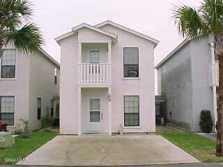 classified as a condo, but it is a free standing home with its own patio space, driveway and in unit laundry