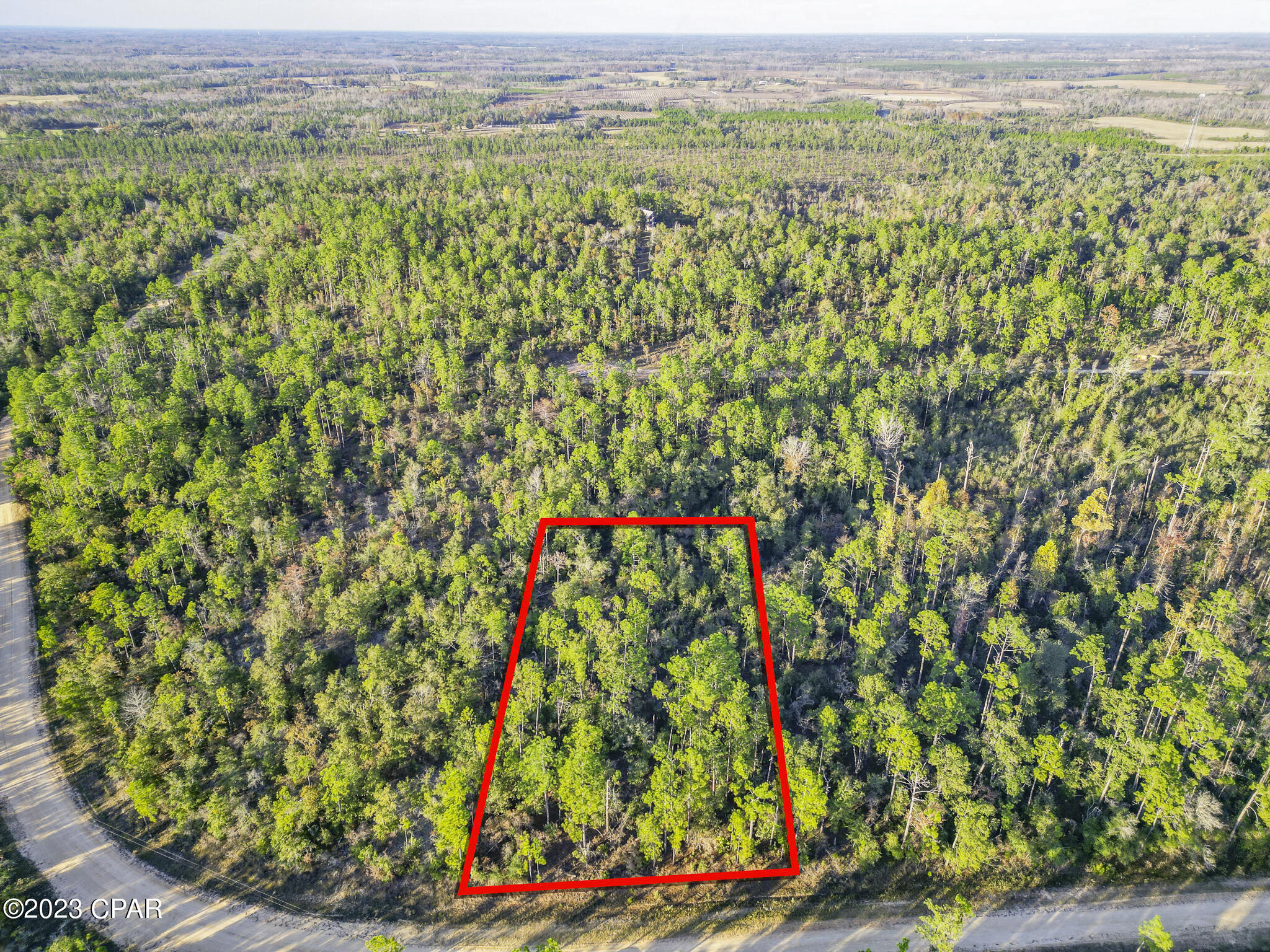 Are you on the hunt for the ideal location to construct your dream home? Look no further than this acre lot in the Compass Lake in the Hills Subdivision! With a boat ramp, dock, clubhouse, swimming pool, two restaurants, disc golf, driving range, and more, this community has everything you need to enjoy the Florida lifestyle. And with an optional $135 annual HOA fee, you can take advantage of all of these amenities without breaking the bank. Plus, with Panama City Beaches just an hour away, you'll have easy access to some of the best beaches in the world. Don't miss your chance to own this incredible piece of property! Lot lines are approximate.