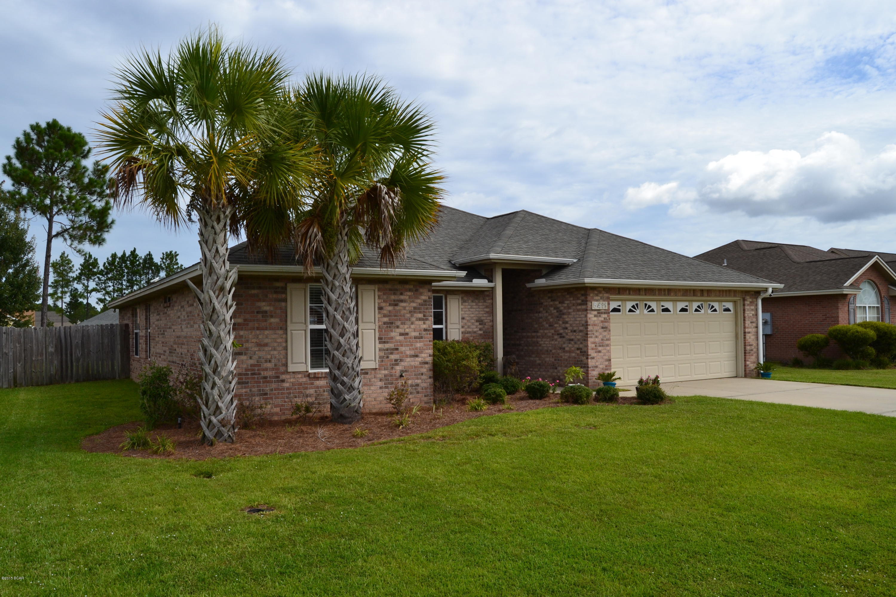 Contemporary styling and quality craftsmanship. This 4 bedroom, 2 bath home with over 1810 square feet lies in the heart of Cherokee Heights,a highly desirable neighborhood. Two of the best Bay County Schools are walking distance away!  The exterior of the home features solid brick construction for ease of maintenance and durability. The interior of the home is an open concept, split bedroom plan with tall ceilings trimmed in crown molding and a corner fireplace as well as hardwood floors and tile in the living areas and wall to wall carpet in 3 of the 4 bedrooms.  For the gourmet chef, the kitchen is loaded with solid wood cabinets topped with granite counter tops.The formal dining room takes care of formal meals  and the breakfast bar is perfect for those quick meals when you are on the go. A jacuzzi tub is perfect for relaxing at the end of the day. Dual walk-in closets provide plenty of storage. A 2 car garage is a bonus for even more storage. Outside, there is a screened in porch overlooking the expansive back yard. A sprinkler system is included to insure a lush green lawn. At $215,000 and at nearly 1900 square feet, this is absolutely one of the best deals in the city. Call today for your private showing.