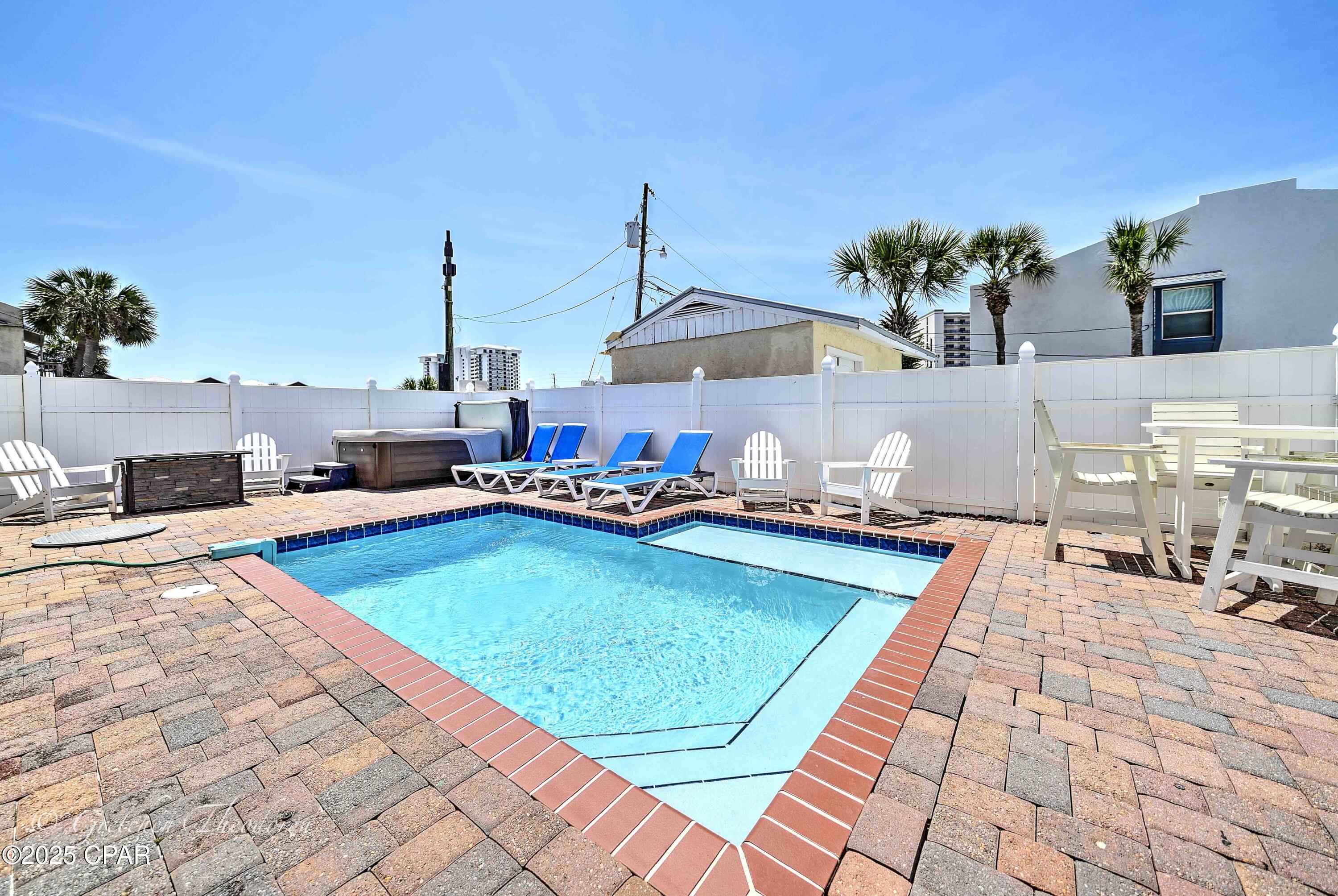 BACK ON MARKET!! HOUSE IS PERFECT! Financing 
issue for buyer.  Exceptional GULF views - Turnkey & Income-Generating.

This impeccably maintained home is the epitome of coastal luxury—complete with a private heated pool, relaxing hot tub, cozy fire pit and a move-in ready interior. Featuring two living rooms, three spacious king en suite bedrooms plus additional bunk accommodations, there's ample room to comfortably host three families......sleeps 14!!

Located just steps from the beach, this home includes a golf cart, allowing you to effortlessly cruise to the shoreline or enjoy a scenic stroll—that's how close you are. With a solid rental history generating approximately $126K in gross income for 2024, a 9.8 rating on VRBO and a 4.8-star rating on Airbnb (which transfers to the new owner), it offers an excellent investment opportunity.

Recent upgrades include fresh interior and exterior paint, a new water heater, updated window blinds, sand filter for pool (Dec. 2024), composite decks on the second and third-story balcony—providing low-maintenance comfort and style.

Don't miss the chance to own this extraordinary beachside gem. Contact your favorite Realtor today to schedule a private tour—you're going to fall in love!
Buyer to verify all measurements.
