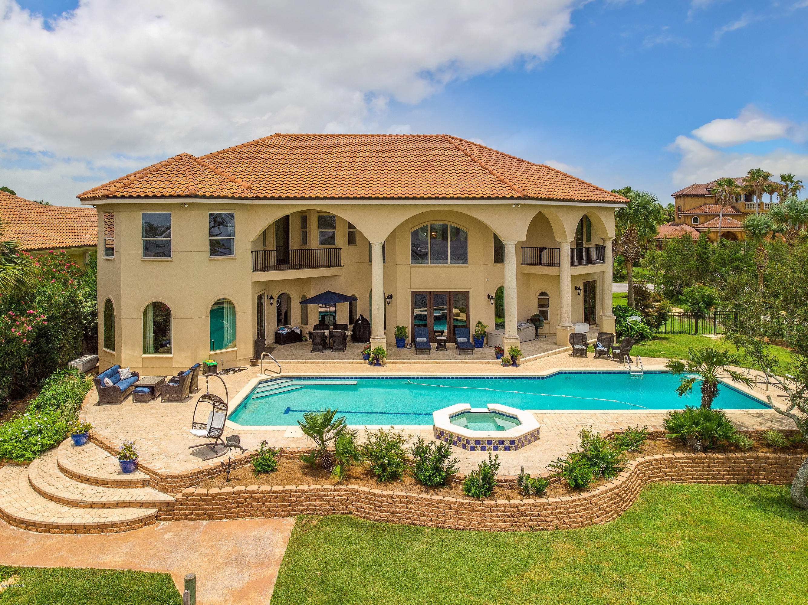 ***Currently under contract, seller accepting back up offers***  This  GORGEOUS Mediterranean design 5bd, 4.5 ba(concrete poured walls) 3 car garage estate home was recently updated. 2 year old roof, new stucco, new flooring, new garage doors, and new pool equipment. Home was designed to showcase breathtaking water views from virtually every room. Interior features include decorative columns, arched windows, wrought iron handrail along the curved stairway and landing, stained pine dome ceiling, and crown molding throughout. Kitchen includes granite countertops, maple cabinetry, sub-zero fridge/freezer, Bosch 6 burner gas stove, GE microwave, double ovens, HUGE walk in pantry, dry bins, and 2 sink areas. Step outside to a 60 ft pool, 500 ft dock with both 60,000 and 10,000 lb boat lifts plus an additional wet slip. FEMA flood zone guidelines have changed to finally allow for affordable flood insurance. Too many extras to list so hurry before this amazing home gets away! All information is estimated so buyers should verify if important to them.