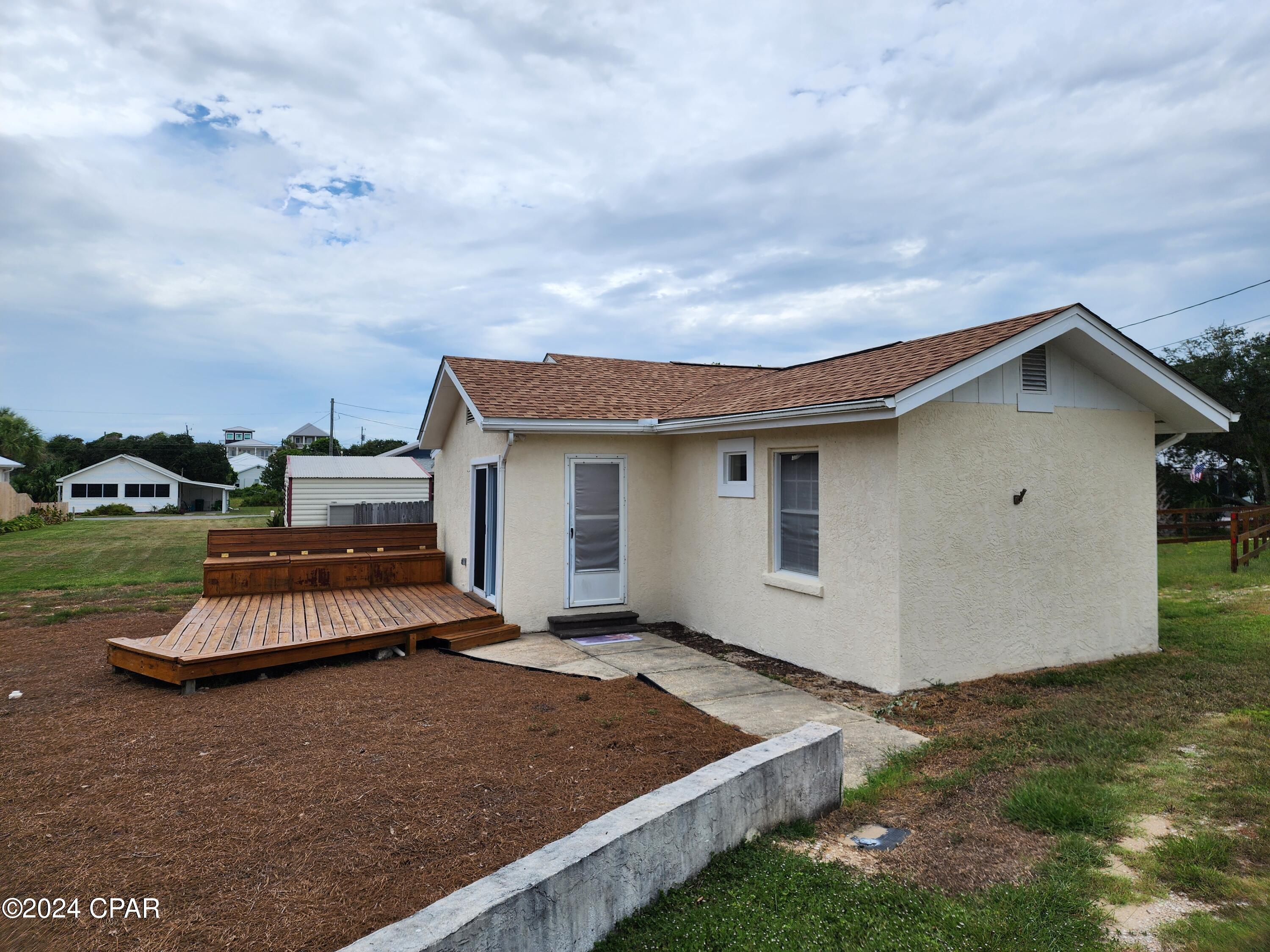 Beach cottage - West End of Panama City Beach - Walk to the beach from this 2 bedroom, 1 bath home featuring open living room/dining room area and open deck. Interior has been freshly painted. Property on septic system. Occupancy limited to 2. No pets allowed. No laundry facilities.
