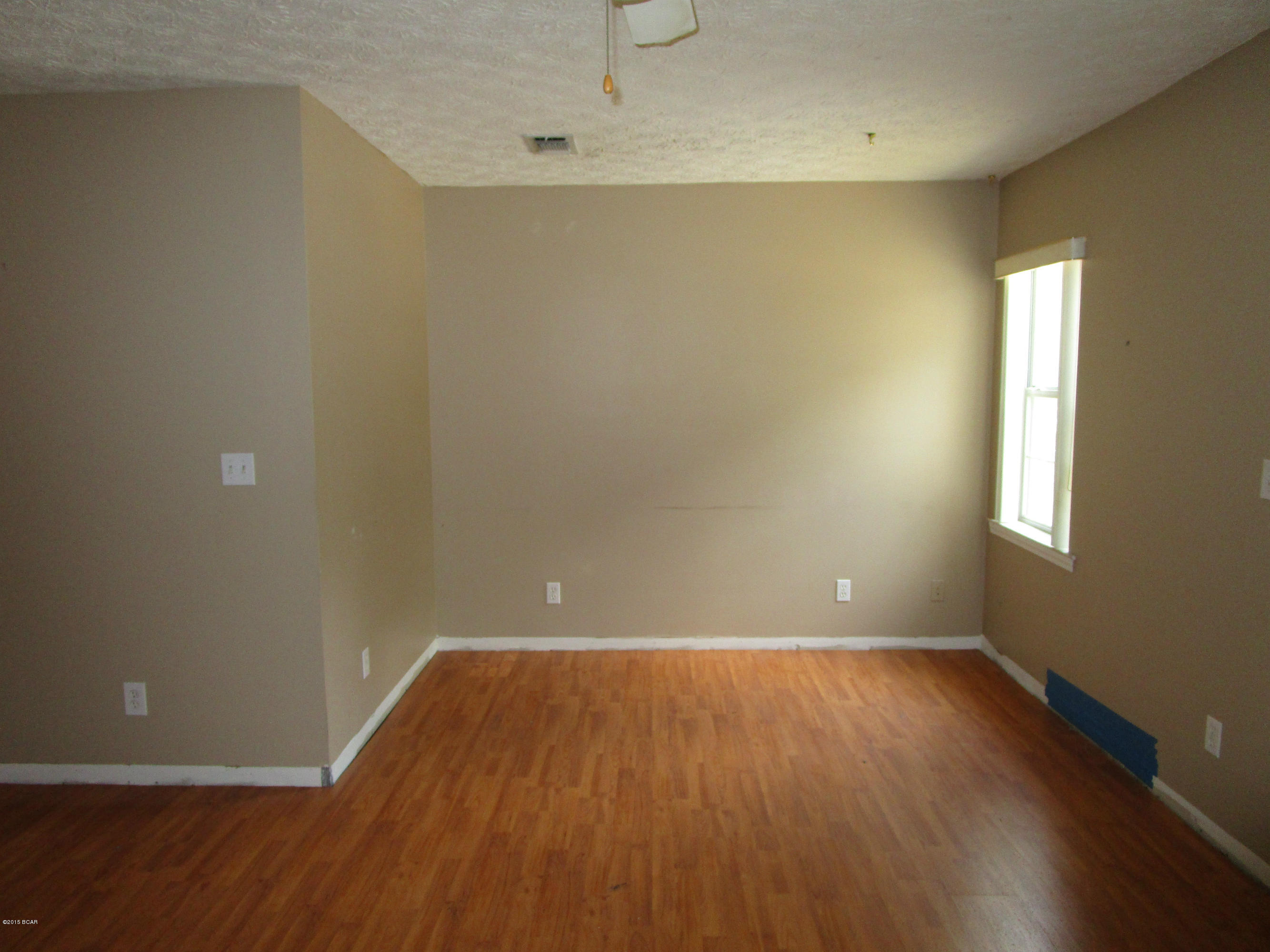 GREAT LOCATION WITHIN THE CITY OF LYNN HAVEN AND WALKING DISTANCE TO THE ELEMENTARY SCHOOL!  This home features a living/dining room combination, a Master bedroom and bath that have been added, and a Family room off the kitchen, as well as a utility room.  The guest bath is conveniently located near the three additional bedrooms.  The back of the home has a large deck that overlooks the backyard with a storage shed and a rear alley access to the lot.  Home is being sold in its AS IS condition.