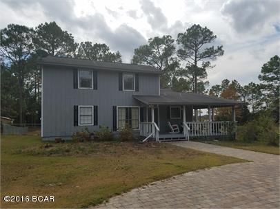 Beautiful Country Home on 2 acres with 2 ponds full of fish!  There is a large front porch to enjoy the quiet, peaceful neighborhood.  The living area is open and spacious with plenty of room for all of your needs!  The home features vaulted ceilings, GE profile stainless steel appliances, granite counter tops, solid wood cabinets & travertine floors!!  The master suite has his and her closets, marble top vanities, whirlpool tub & separate tile shower.  There is also a large carport, workshop area & Basketball goal & court. Call today for more information on this beautiful home!