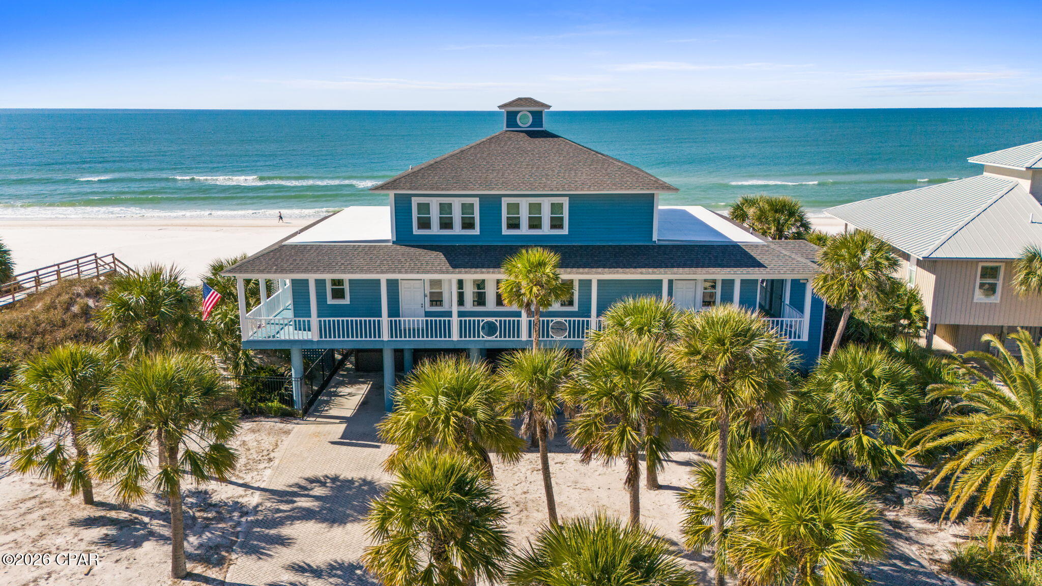 GULFFRONT LEGACY PROPERTY-NOSTALGIC BEACH HOUSE WITH ENDLESS POSSIBILITIES!  A rare Gulf-front coastal sanctuary offering 100' of pristine, sugar-white beachfront, fully gated & framed by a lush palm forest that immediately sets the tone for privacy, nostalgia & timeless coastal living. This is the kind of property families pass down for generations—a classic beach house where memories are made, sunsets are savored & life slows to the rhythm of the tide.  Set within the coveted Secluded Dunes area alongside St. Joseph Peninsula State Park, this homesite is next to nearly 10 miles of untouched, undeveloped shoreline—an irreplaceable setting where nature remains the star. The existing 4-bedroom/3-bath residence with open-concept living is designed for relaxed coastal living with expansive Gulf views, soaring ceilings & abundant natural light. The primary suite captures panoramic views with direct deck access. The generous wraparound deck offers multiple vantage points to enjoy sea breezes, star-filled evenings & the soothing sounds of the Gulf. Thoughtful features include an elevator, swim spa, hot tub, outdoor shower, ample storage, covered parking & low-maintenance coastal landscaping. Elevated on pilings, the home blends comfort, practicality & classic coastal charm. This property presents exceptional flexibility:-Cherish & remodel the existing home as a nostalgic family beach house-Utilize the site as two separate Gulf-front lots-Remove the existing structure & build two brand-new luxury beach homes. Few properties offer this level of versatility, frontage & location on one of the most beautiful beaches in the world. Step directly onto the soft sands where swimming, fishing, kayaking & dolphin watching become part of daily life. Whether envisioned as a legacy property, redevelopment opportunity or forever family retreat—this Gulf-front offering is truly one of a kind. Call for your private tour & LIVE THE BEACH LIFE the way it was meant to be lived!!