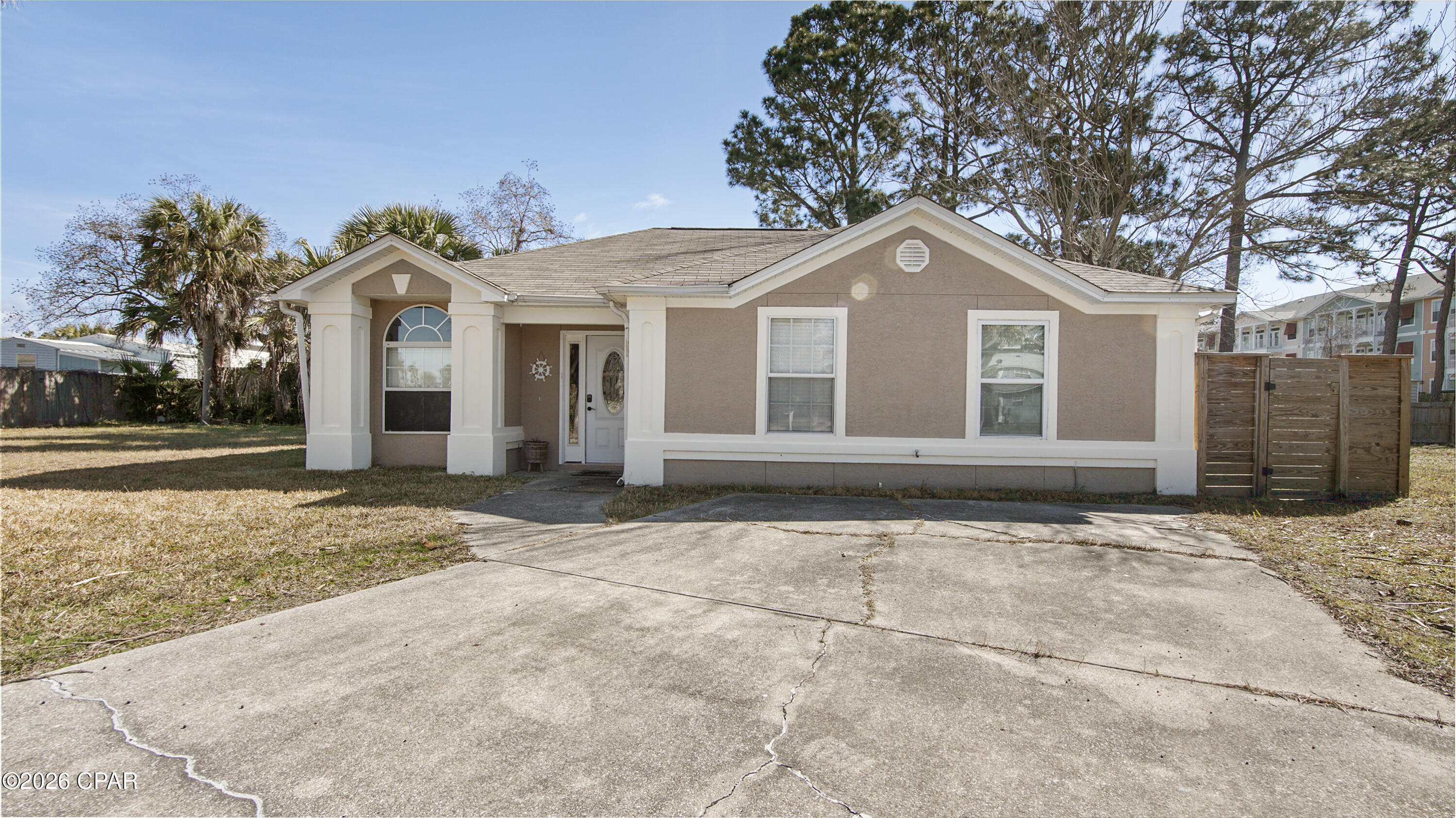 Recently upgraded and move in ready, this 3 bedroom, 2 bathroom home offers 1,074 square feet of comfortable living space and is ideally situated on a 3,049 square foot lot in the heart of Panama City Beach. Small but mighty, this home features a perfectly flowing layout that makes the footprint feel spacious and functional.

Inside, you will find modern updates including a stylish tile backsplash and upgraded tile showers, giving the home a fresh and updated feel. Major systems have already been addressed for peace of mind, with a 2023 roof report indicating at least 10 years of remaining life, along with a brand new HVAC system and water heater installed in 2023, helping minimize future expenses.

Enjoy a fully fenced backyard perfect for pets, kids, or entertaining. The property also offers rare added privacy with vacant lots on both sides, one of which is county owned, so you will not feel crowded by neighboring homes.

Located just minutes from the white sand beaches, this home is perfectly positioned for both locals and tourists alike, with convenient access to shopping, dining, and entertainment. Situated within a desirable school zone, it is also a great option for families. Located in an X flood zone, this property does not require flood insurance, adding even more value and affordability.

Whether you are a first time homebuyer, searching for a vacation home, or looking for a strong short term rental opportunity, this property offers the ideal combination of updates, location, and long term value.