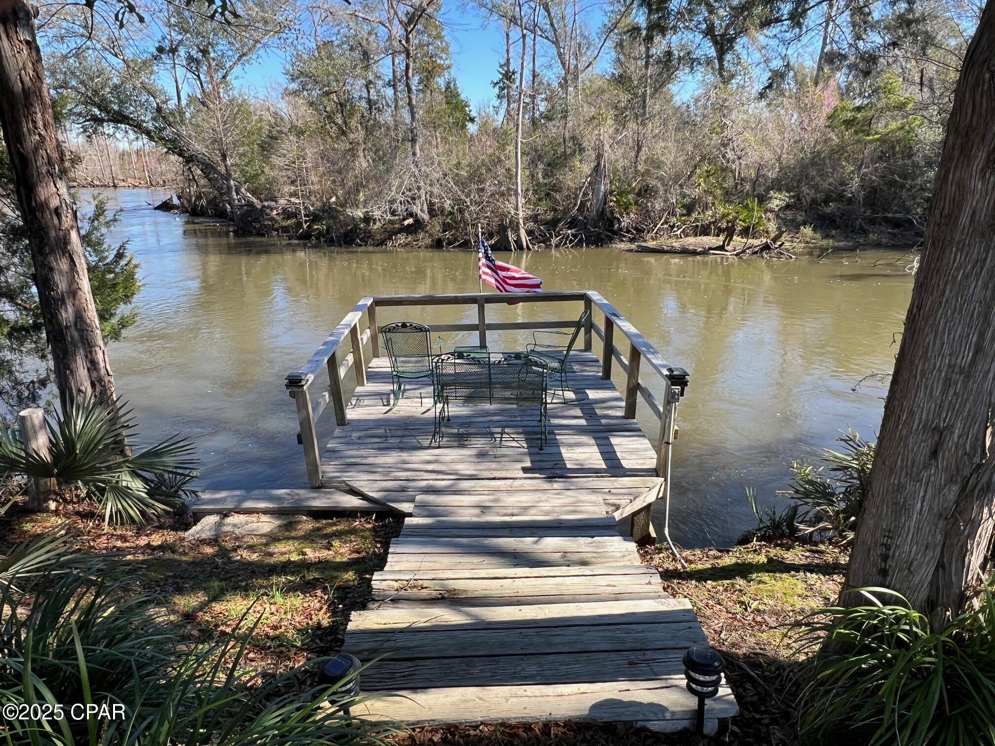 This is a beautiful 90-acre tract with over 500 LF on the Chipola River with a nice well maintained home. Private boat ramp. Nice private fishpond on the property. Deck over river. Paved roads all the way to the property. Discover the serene beauty of Marianna, FL, where the Mears Chipola River Tract is nestled within picturesque surroundings. This charming area boasts a rich tapestry of natural wonders, including the stunning Chipola River and the expansive Chipola River Wildlife Management Area, offering outdoor enthusiasts a variety of recreational activities. The nearby town of Marianna provides a warm, welcoming community with convenient access to local shops, restaurants, and cultural attractions. With its abundant natural beauty and close-knit community, this area holds immense potential for land and residential investors seeking a peaceful retreat in a truly idyllic setting.