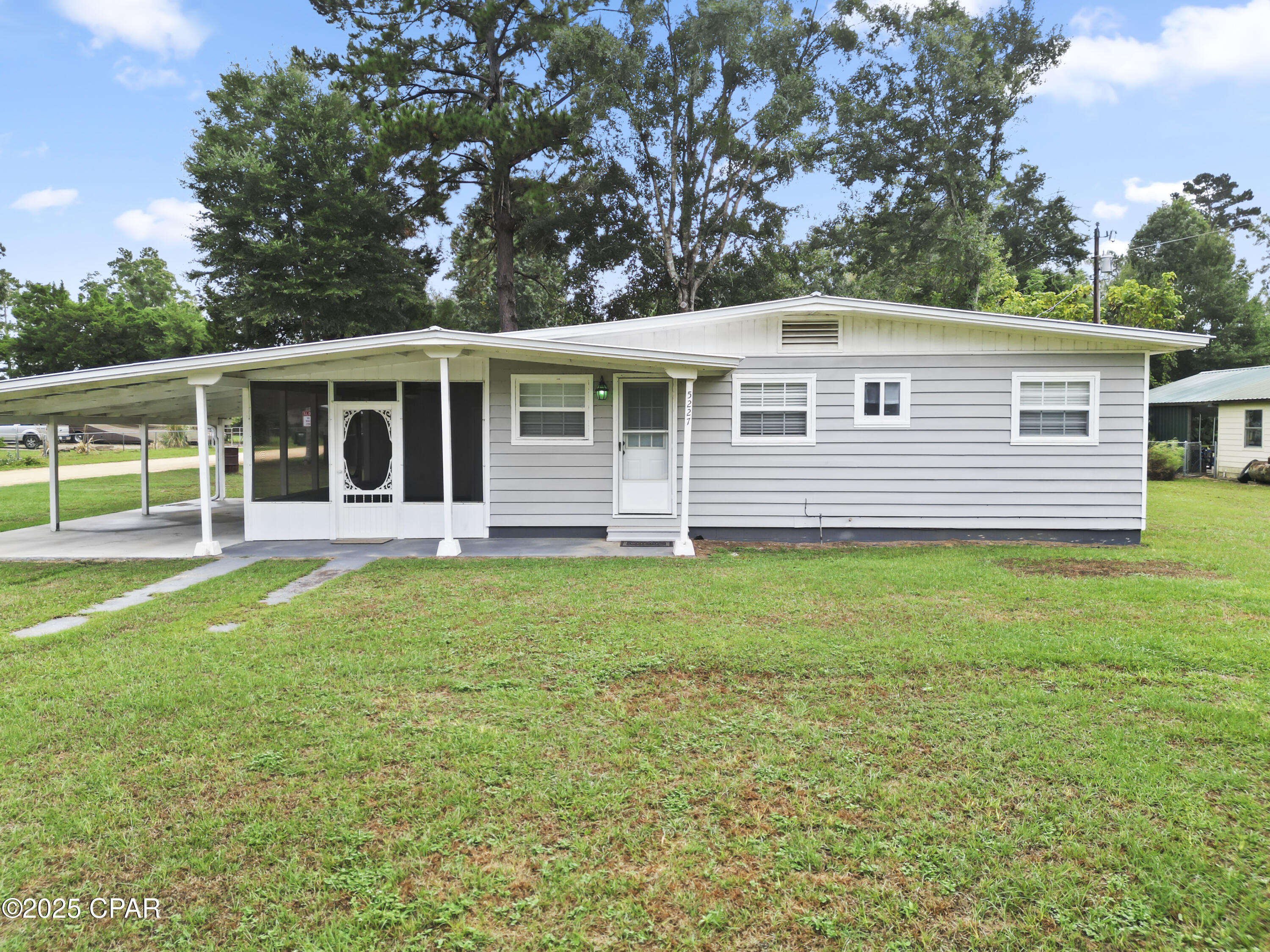 Price Reduced!  This property is a must see! Welcome to this fully furnished 2 bedroom 1 bath country home nestled in a small community right along the Chipola River.  Located on a corner lot, this adorable home has a screened in porch along with a covered carport with new concrete flooring.  There are also two large storage sheds, one with electricity, which will convey with the home.  The inside features newer stainless steel appliances with tile backsplash and beautiful real wood floors!  The utility room is over sized for additional storage and includes a top of the line water filtration system.  This location not only offers a boat ramp for the residents of this community, but some of the world's most beautiful beaches are only a 40 minute drive away!  A new hospital is located only minutes away.  Don't let the opportunity for quiet country living in this adorable home pass you by!