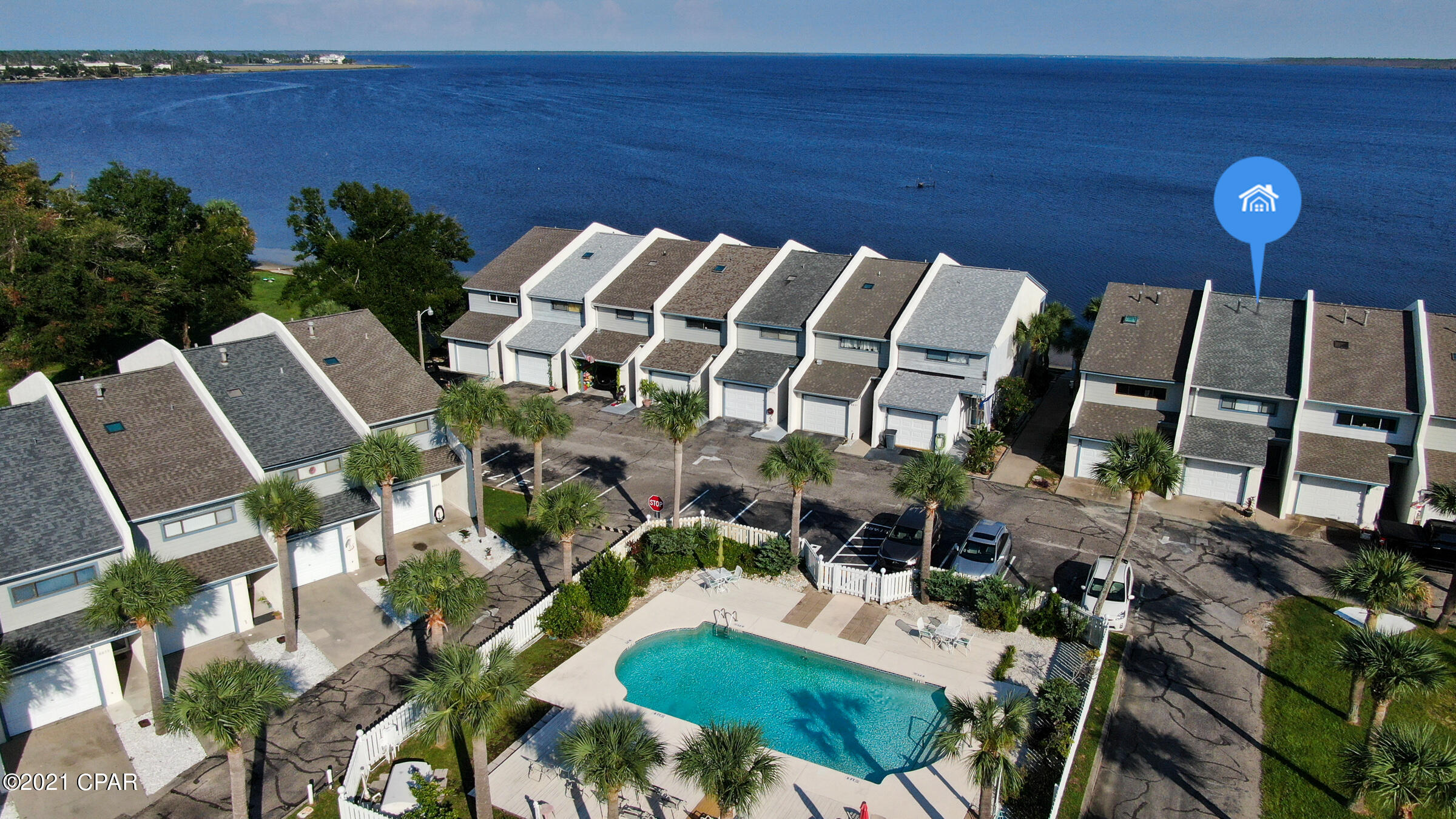 Bay Waterfront!  Enjoy this spectacular view all day everyday on your enclosed porch or master bedroom balcony. Wake up to this awesome view! This townhouse features tile flooring in foyer, kitchen, baths and laundry room.  Updated fully equipped kitchen with granite countertops and appliances, open breakfast bar to the living room and dining with bay view, half bath and laundry room on first level.  Master bedroom and updated bath, two guest bedroom and full bath. Roof and AC 3 years new. This fabulous townhome is minutes to Tyndall Air Force Base, shopping and restaurants.  Fish from your backyard, association includes pool, lighting ingress and egress driveway and common areas.