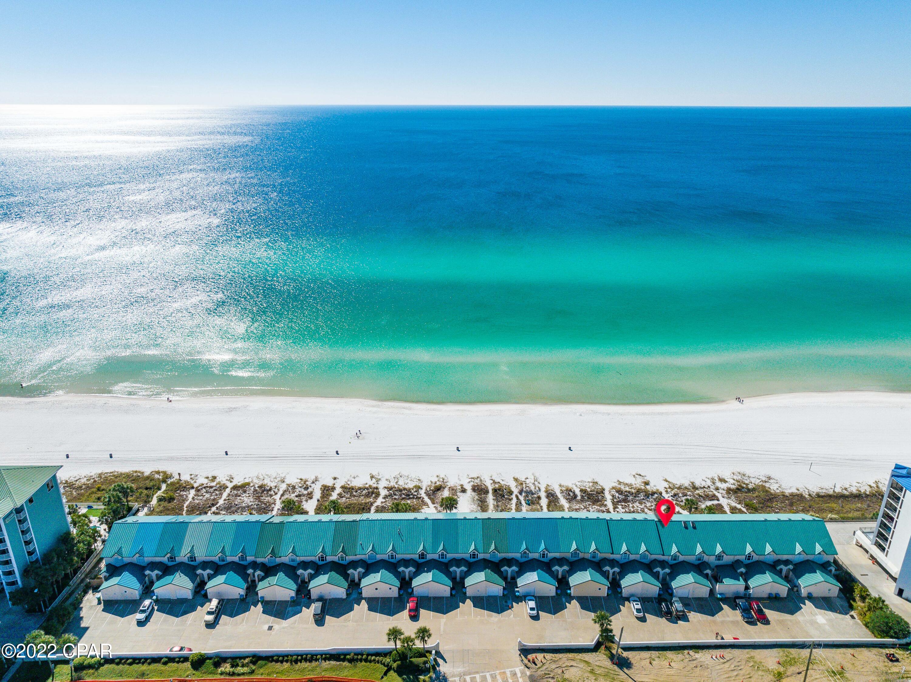 CURRENTLY UNDER CONTRACT, SELLER WILL CONSIDER BACKUP OFFERS Move right in and start enjoying all that peaceful coastal living has to offer. This is impressive an amazing gulf-front townhome with 2 bedrooms and 3 bathrooms and loads of character. You will notice the breathtaking panoramic views from the moment you enter. With vaulted ceilings paired with the open floor plan it was clearly designed to keep all of nature's elements in sight. Enjoy brilliant sunrises as well as exceptional dolphin spotting from the 180-degree open water views of the Emerald Coastline. Recent upgrades include: New storm windows 4/22, downstairs flooring 11/21, and AC unit 12/20. The inviting family room which looks out onto the water is adjacent to the kitchen and provides the perfect space for seamless entertaining. The kitchen is large and spacious. A gorgeous tile shower/tub combo, large vanity & custom walk-in closet complete the owner's suite. Celebrate paradise-living with your own large private deck and deeded beach access right outside your living room. This home comes fully furnished... rental or move-in ready. 

With new windows and many other renovations, Unit 7 would make an excellent rental property or an amazing beach home. Ideal location central to 30A and Pier park. ** All information to be verified by buyer.