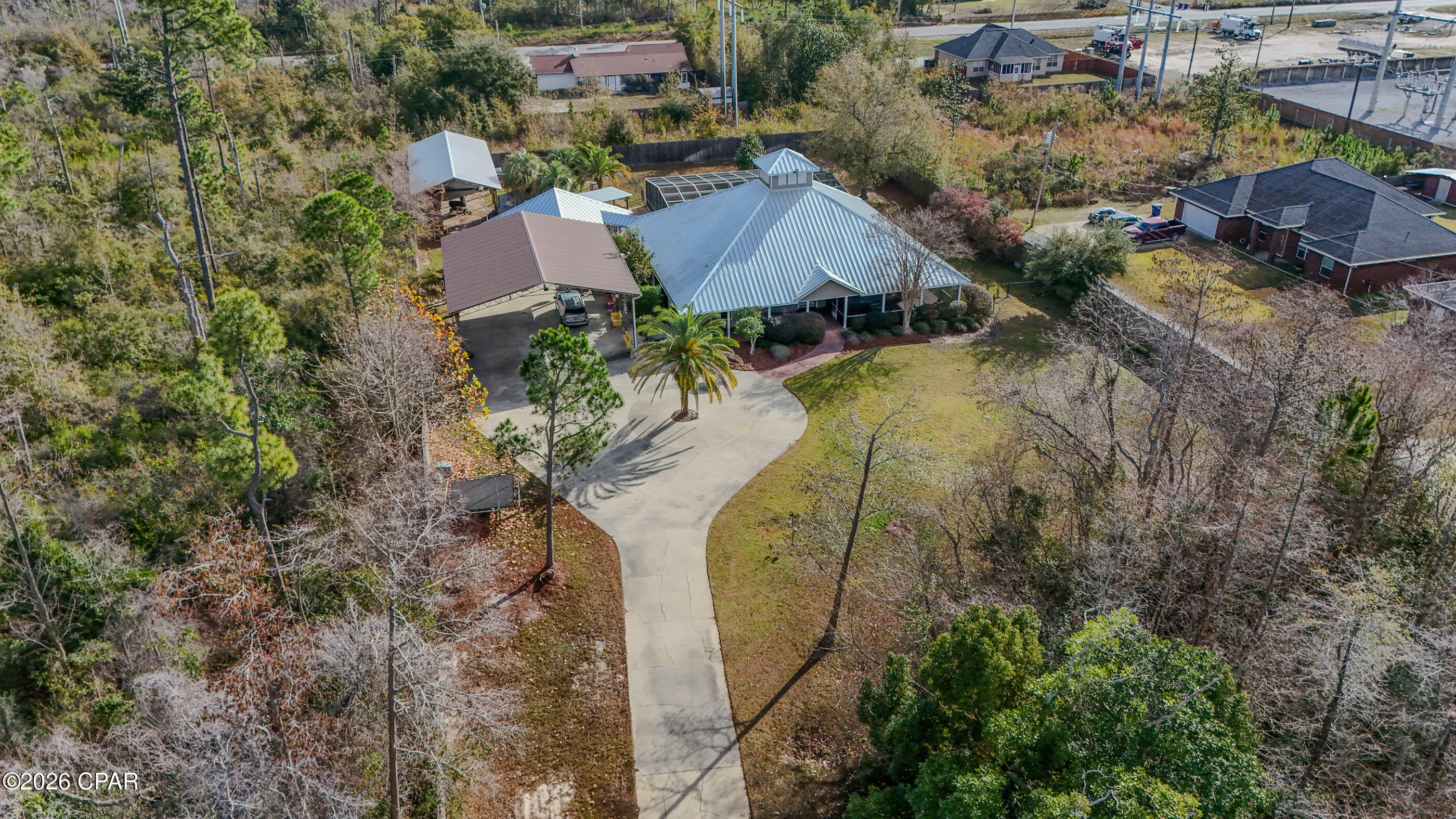 This spacious 6-bedroom, 4-bath home offers 4,230 square feet of comfortable living space on a private 1.53-acre property, perfectly designed for both everyday living and entertaining.

Inside, the generous floor plan accommodates family, guests, or multi-generational living with ease. Recent upgrades include new flooring throughout completed last year and new kitchen quartz countertops, also installed last year, adding modern style and durability. The home is further enhanced by twin tankless gas water heaters, providing efficiency and continuous hot water.

Outdoors, enjoy a true backyard oasis ideal for year-round enjoyment. The fully fenced yard features an in-ground pool, spa/hot tub, and a built-in barbecue and grill area with ample seating—perfect for hosting gatherings or relaxing in a resort-style setting. A standing seam metal roof installed approximately 1.5 years ago adds long-term value, durability, and peace of mind. Just ½ mile from SweetBay, you're close to shopping, dining, and everyday conveniences while still enjoying plenty of privacy.

With exceptional outdoor amenities, thoughtful upgrades, and a desirable location, this property offers a rare opportunity to own a home that truly blends space, functionality, and an entertainer's dream backyard.