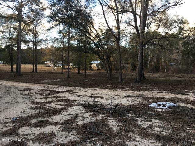 Nestled in the highlands of the central panhandle of Florida is this sanctuary setting where you can escape to your own country estate. This land is over 7 acres is mostly fenced, has a pond and is only about 25 minutes from some of the worlds most beautiful beaches. Come to this inviting spread and build the home of your dreams.