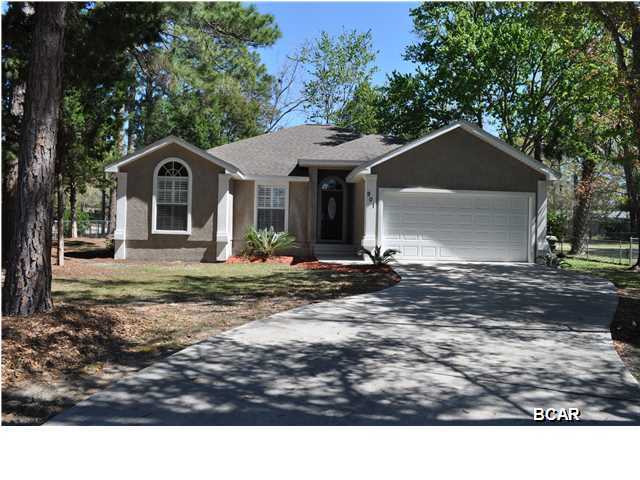 **SELLER MOTIVATED, BRING ALL OFFERS** One owner, custom built family home on a large corner lot in Lynn Haven. This is a move-in ready 3BR/2BA house with lots of space inside and out. The home features a split-bedroom floor plan with 2 master suites; both en suites even have separate showers and whirlpool tubs! The living room is warm and welcoming with crown molding adorning the raised ceilings, and a cozy fireplace flanked by built-in bookshelves. The eat-in Kitchen is a sight to behold with Corian countertops, a center prep island, custom cabinets with extra large drawers, a pantry, and a large window seat with extra storage. The Florida Room is perfect for a tranquil reading spot or as a child's play room. It overlooks the large and fenced backyard where your kids can play safely.