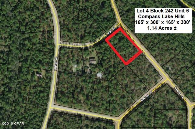 REALLY PRETTY, HIGH & DRY, NICELY WOODED 1+ Acre Lot in the Compass Lake in the Hills community of NorthWest Florida. Site Built or Modular Homes only in this area of the Subdivision, no Mobile Homes. Conveniently located just 15 minutes South of Interstate 10 at Marianna and 40 minutes North of Panama City for Shopping, Restaurants, Entertainment, and Beautiful Gulf Beaches. As an owner in this development you have access to Private McCormick Lake for Swimming, Fishing, Canoeing, Kayaking, etc, as well as the Main Lodge on Compass Lake with Swimming Pool, Tennis Courts, etc. There is a $ 50 per year per lot MSTU Assessment by Jackson County on each lot in this Subdivision. ACT NOW to take advantage of this opportunity to buy at a Great Price !!