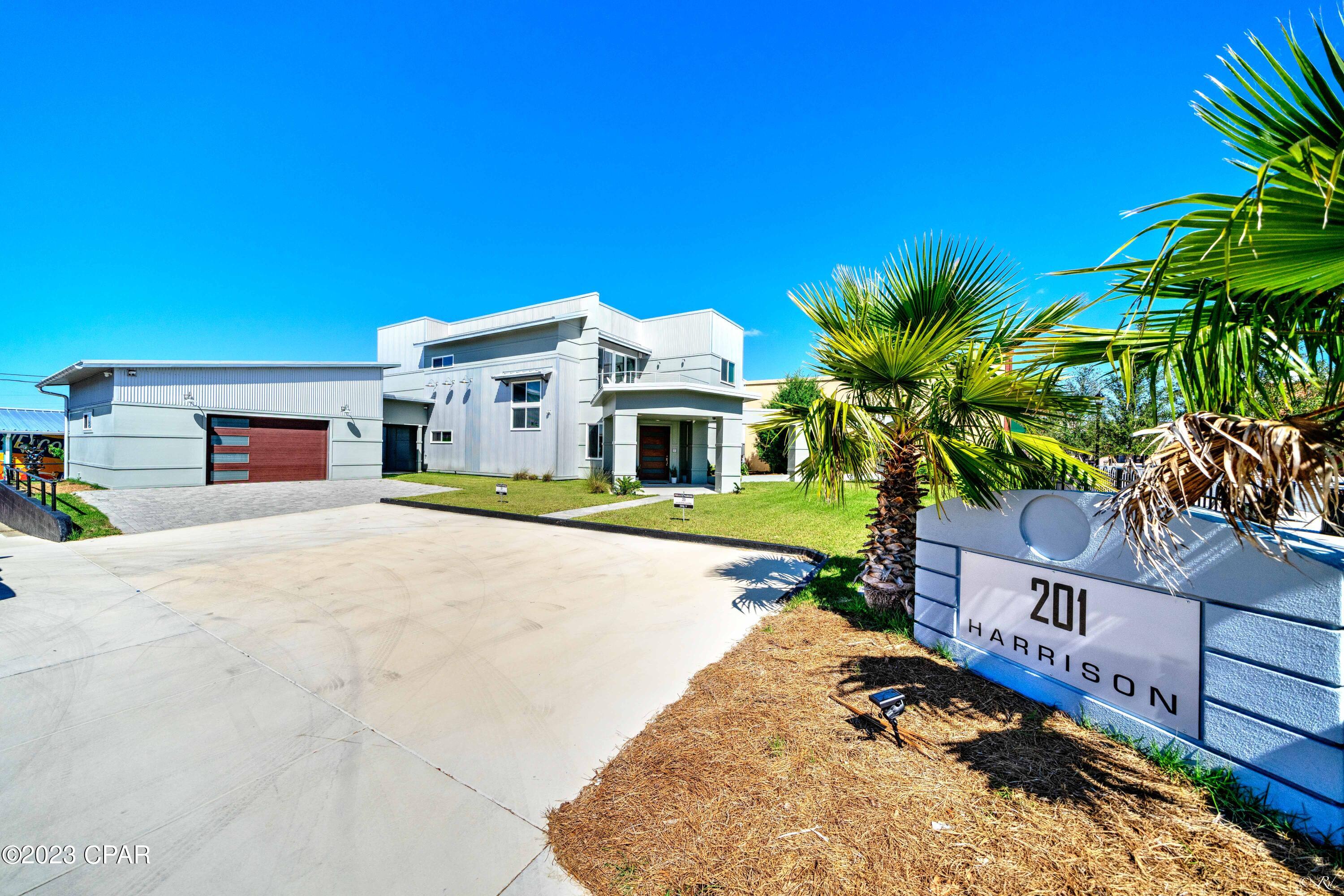 UNIQUE!! Here is your QUINTESSENTIAL, ONE-OF-A KIND HOME!!! Prepare to be captivated when you enter through the oversized mahagony front door. There you will meet a blend of industrial, contemporary construction.....yet boldly charming. The kitchen will inspire the chef in you - a Wolf 5 burner gas cooktop located in the enormous island, Dacor double ovens with separate warming drawer, Subzero French door refrigerator, Gaggenau dishwasher, wine fridge and entertainment sink. Garage has been converted to an AMAZING CASITA!! Or, move furniture, park your cars there. The walkability to St. Andrews Bay and the multitude of amazing local restaurants, breweries, coffee shops and unique shopping experiences make this property truly AWESOME!!!  Also includes a whole house gas generator, separate HVAC systems for both floors, a SONOS system (wired for sound) throughout as well as a gas Riannai water heater. Being sold FULLY FURNISHED!! Use as an Airbnb or Family Home. Call your Favorite Realtor to see this one today - experience the epitome of contemporary living in a DOWNTOWN setting. Buyer to verify measurements.