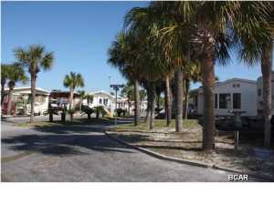 Incredible location on this fantastic corner lot in Venture Out. Lot is located near the front of Venture Out and only a few steps to World Most Beautiful Beaches! This lot includes concrete pad, hookups for electric, water and sewer. Don't wait this one won't last long! Venture Out offers BOTH beach and bay access! The resort also has 2 salt water pools, one heated, tennis, golf, shuffleboard, playground, basketball, fishing pier, boat dock with slips & boat ramp. Venture Out is a golf cart community that has exploded in popularity within the last few years. A gated, pet friendly community that's great for full time residency or just to vacation. 24 hour security & friendly atmosphere. It's all here in Venture Out!