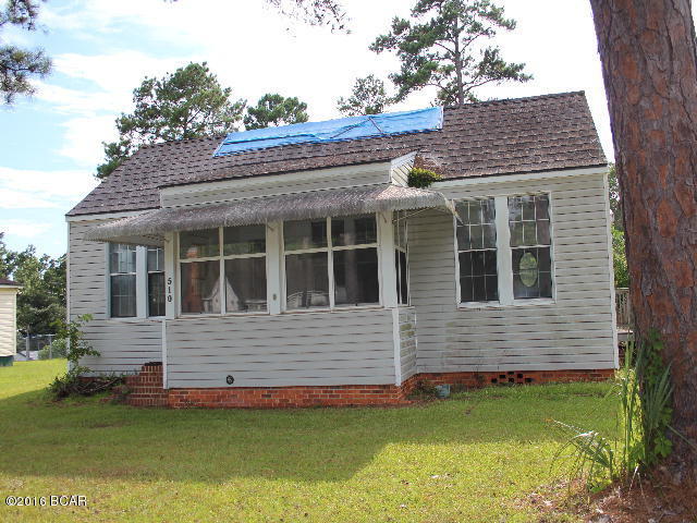 Cottage style home just waiting for someone to bring her back to her potential. Interior needs complete renovations but this is a great investment property! It has 3 bedrooms and 2 baths, one of which needs installation. There is an enclosed sun porch and there is a large detached garage/workshop. The side entrance is handicap accessible. Room sizes are estimated.