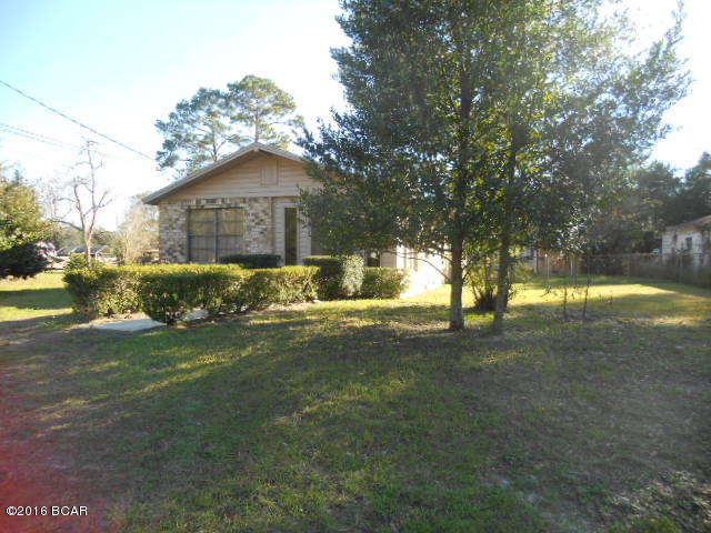 3 bedrooms and 2 baths with Living room, dining area and small family room. Large carport will accommodate 2 cars easily.  The washer/dryer hook up is in a small building in the backyard plus there is a very nice aluminum storage shed.  The backyard is enclosed with a chain link fence with a rolling gate to the carport. Very large corner lot. Owner had started remodeling but not finished. Needs some sheetrock in 2 bedrooms and some cosmetic work but otherwise a good buy for a centrally located home.  This property is offered As Is.  Zoning is residential/commercial.