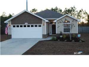 This beautiful home is in a newer subdivision of Northwoods Residential. This subdivision has underground utilities and the home sits near the end of this culdesac street. Upon entering the home you will notice the mosaic tile in foyer that leads to the hardwood floors in the living room. The living room has 11 ft trayed ceilings with recessed lighting. The home was built with quality fixtures and finishing ends- Granite counters in kitchen and bathrooms along with nice cabinetry, stainless steel appliances, brushed nickel fixtures, built in blinds in doors, nice lighting package, and crown moulding. The sellers have added wood flooring (not laminate) tiled back porch, privacy fenced back yard, and a glass storm door on front entrance. The Master bedroom has hardwood floors, 9 ft