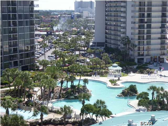 ~~~~JUST REDUCED~~~This has been a NON_RENTAL unit but it being sold furnished. Once you walk in the door of this unit you know you are at the beach and you can't be anything but happy with all the bright colors. Many upgrades but, starting with wainscoting on the ceiling to granite kitchen counters, Kraftmaid Cabinets, Vessel sink in the master, all showers are tiled and are not your standard showers/tubs. The views are endless from the unit and the balcony. Enjoy the many pools, golf, tennis and most of all BEACH.