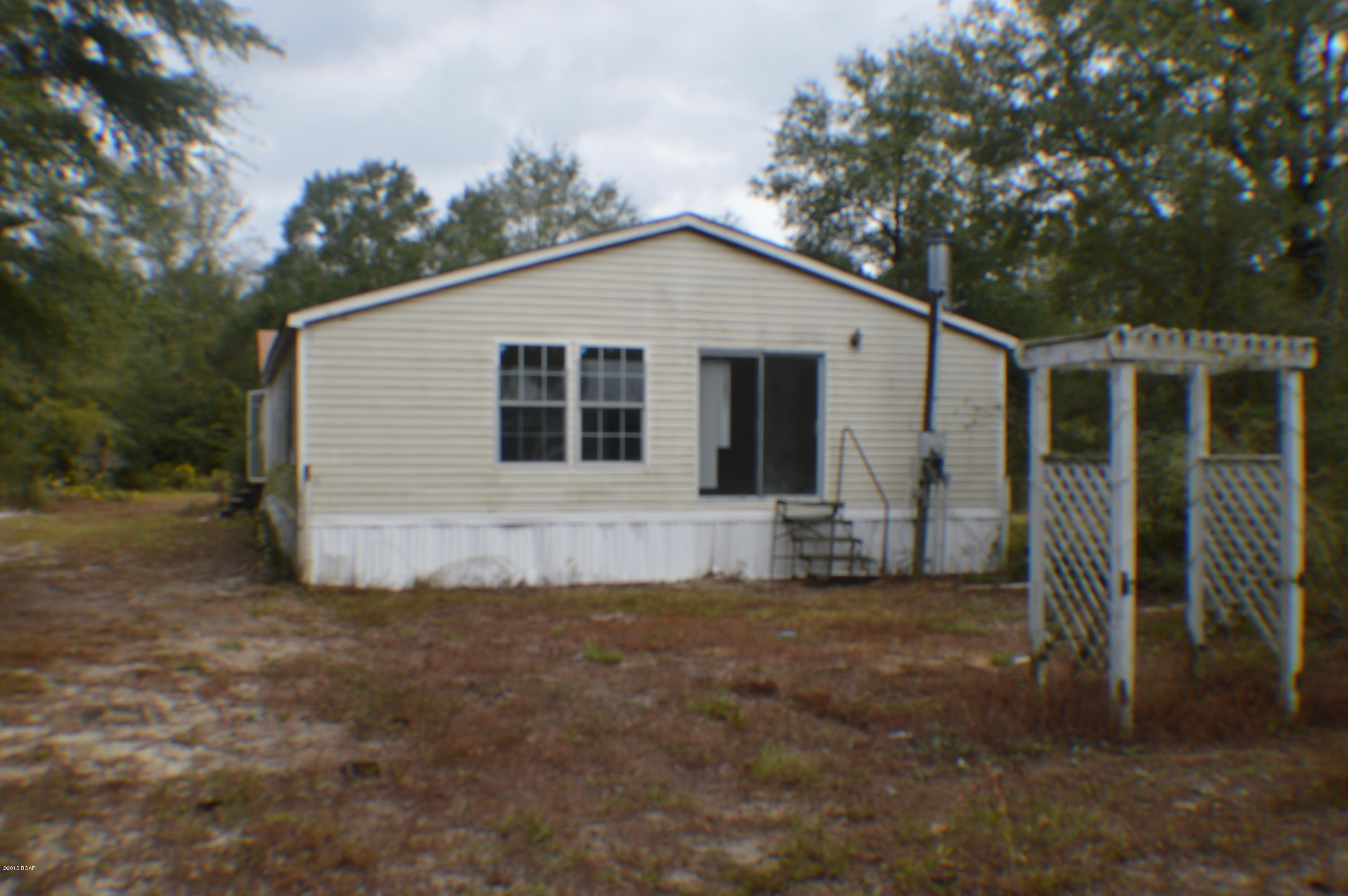 Looking for privacy? This property offers privacy & seclusion in the country! Property consisting of 19.436 acres with large double wide mobilehome with 4 BR and 2 B, home needs some work definitely has LOTS of potential. Property is less than one mile from Hwy 231.