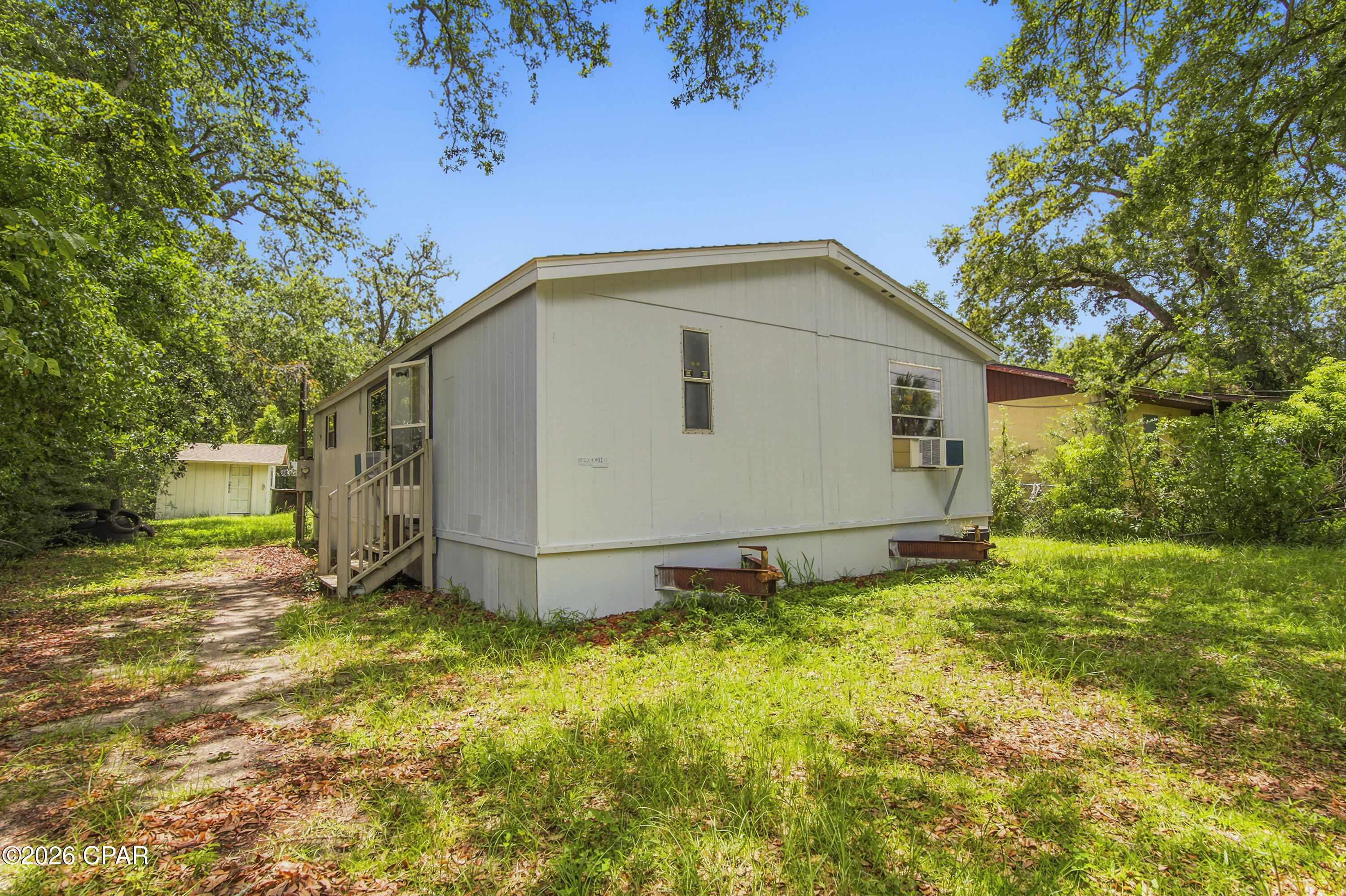 Welcome to 744 Sheffield Avenue in the heart of Springfield! This well-maintained 3-bedroom, 2-bath double-wide manufactured home offers an affordable opportunity for homeowners or investors alike. Featuring a functional floor plan, spacious living areas, and a partially furnished interior, this home is move-in ready with all appliances conveying, making your transition even easier.
Situated on a generously sized lot with mature shade trees, you'll enjoy plenty of outdoor space for entertaining, gardening, or simply relaxing. Conveniently located just minutes from Rutherford High School, Tyndall Air Force Base, Downtown Panama City, St. Andrews Bay, local marinas, parks, shopping, dining, and medical facilities, this property offers easy access to everything you need while maintaining the charm of an established neighborhood.
Whether you're searching for your first home, a downsizing opportunity, or an investment property, 744 Sheffield Avenue is full of potential. Schedule your private showing today!
All information is deemed reliable but not guaranteed. Buyers are encouraged to verify all measurements, dimensions, school zones, zoning, and any other information they deem important.