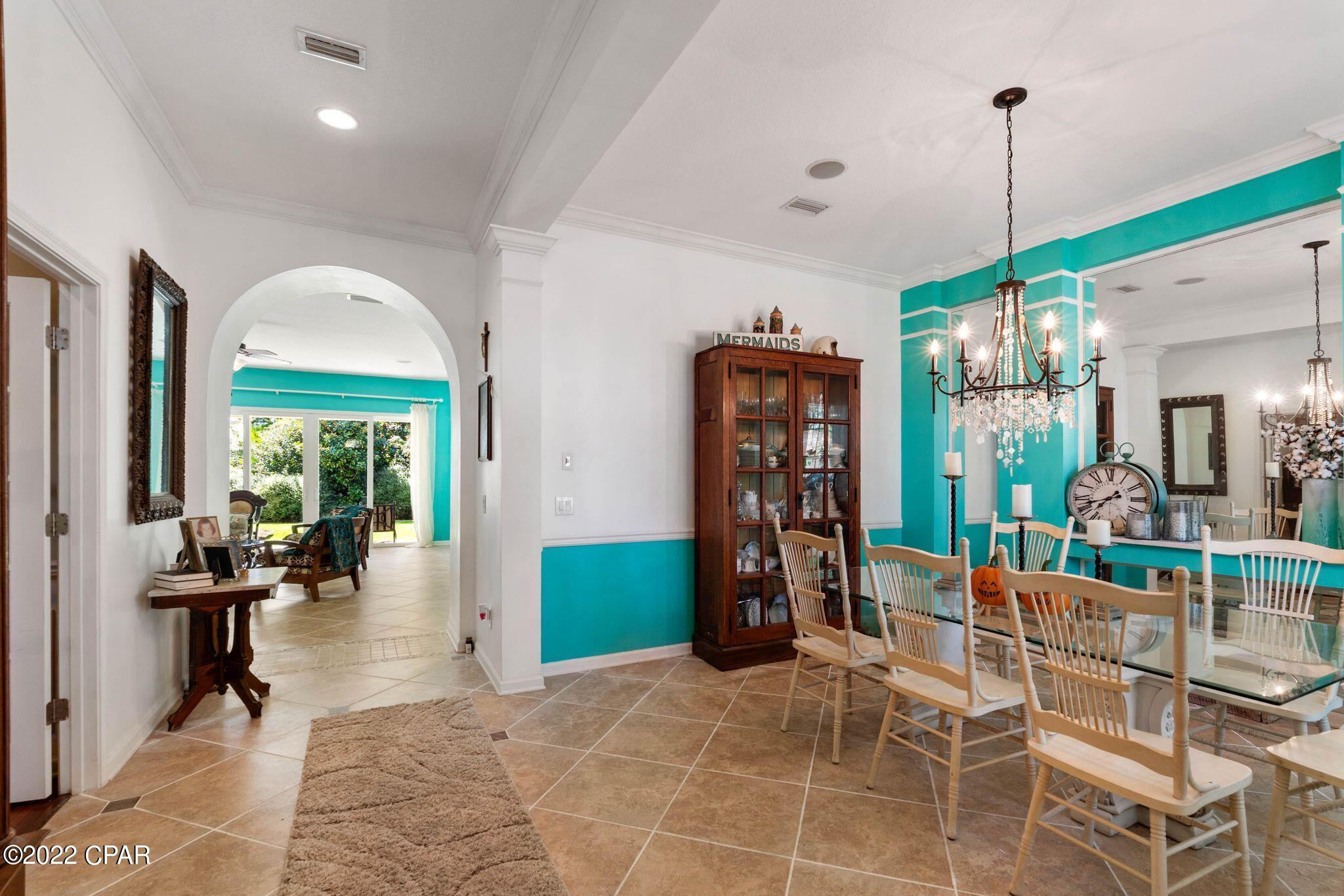 CURRENTLY UNDER CONTRACT. SELLER WILL CONSIDER BACK UP OFFERS. 4bd(w/office), 4bath home in Palmetto Trace, arguably the best located community in Panama City Beach. 1/2 mile from the beach, 2 pools, golf cart friendly and next door to Pier Park. Lot next door is common area so no neighbors...ever. Upgrades include: Custom hurricane shutters and screens, Sept 2022 roof, 1 A/C(2019), new exterior paint, glass shower doors, quartz countertops, tile backsplash, stainless steel appliances, upgraded chandeliers, extra attic insulation, upgraded pantry and laundry room, GE Smart System, wall to ceiling bathroom tile, and...THE SELLERS ARE LEAVING A GOLF CART!!! Some furniture will convey if buyers want it. All information is approximate and should be verified by buyers if important