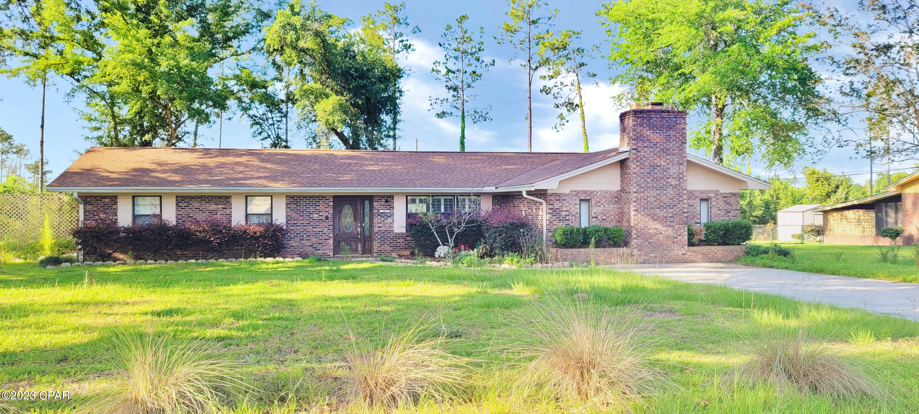 Great Brick 3 Bedroom 2 Bath Large Family home with 2229 sq ft in Marianna!! This home has plenty of room for you!! There is an office off the kitchen that can be easily converted to a 4th bedroom. The Huge 19x19 family room boasts a beautiful brick wood burning fireplace! There is an over sized laundry room. The family room off of the kitchen has French door leading to the backyard. The kitchen has a breakfast bar and a pantry. The property has 2 separate lots that totals 1.25 acres and is high and dry and cleared of trees with plenty of room for the kids to play! There is a detached garage and a storage building with an additional 2 car carport. With a little TLC this can be the perfect home for your family! This home will NOT last long so call today for your personal showing!