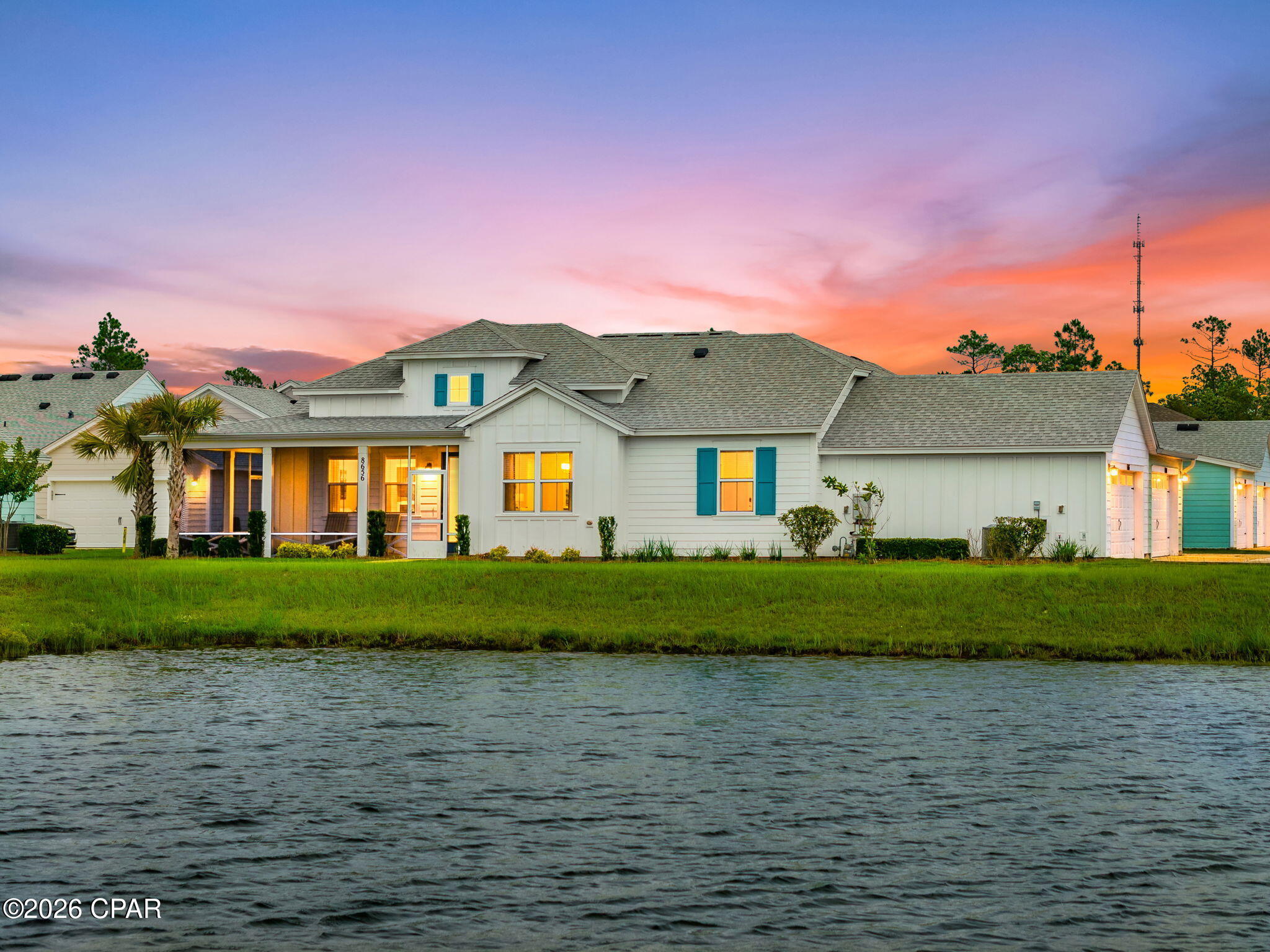 Rare Waterfront Dreamsicle Cottage in Latitude Margaritaville Watersound, Phase 4 close to the amenities. This beautifully Dreamsicle floor plan offers 2 bedrooms, a flexible den/office, 2 bathrooms, and an exceptional lakefront setting with breathtaking western-facing sunset views over the water.

Designed for Florida's indoor-outdoor lifestyle, the home features a spacious screened wrap-around lanai and panoramic waterfront views. A green space lead directly to the lake, creating the perfect setting for entertaining, relaxing, or enjoying peaceful evenings by the water.

Inside, you'll find a bright coastal-inspired interior with an open-concept layout, soaring cathedral ceilings, and stunning water views from the Great Room, dining and second bedroom. The upgraded kitchen features white cabinetry, granite countertops, and abundant storage, while luxury vinyl plank flooring flows throughout the home for a seamless, low-maintenance finish.

The thoughtfully designed split-bedroom floor plan provides privacy for owners and guests alike. The guest suite is located adjacent to a full bath, while the versatile den offers endless possibilities as a home office, hobby room, media room, or additional guest space.

Additional benefits include a remaining builder 10-year structural warranty and Cottage HOA coverage that includes scheduled exterior repainting and roof replacement, providing peace of mind and exceptional value.

Residents enjoy the award-winning Latitude Margaritaville lifestyle featuring:

* Resort-style pool and indoor lap pool
* State-of-the-art fitness center
* Pickleball, tennis, and sports courts
* Walking and biking trails
* Full-service two-story waterfront restaurant overlooking the Intracoastal Waterway
* Live entertainment, social clubs, concerts, and year-round activities

Conveniently located approximately 7 miles from Panama City Beach and near the new Publix-anchored shopping center and expanding medical corridor, this home offers the perfect combination of waterfront tranquility, resort-style amenities, and everyday convenience.

Don't miss this rare opportunity to own a waterfront cottage with sunset views in one of Florida's premier active adult communities on the Emerald Coast.