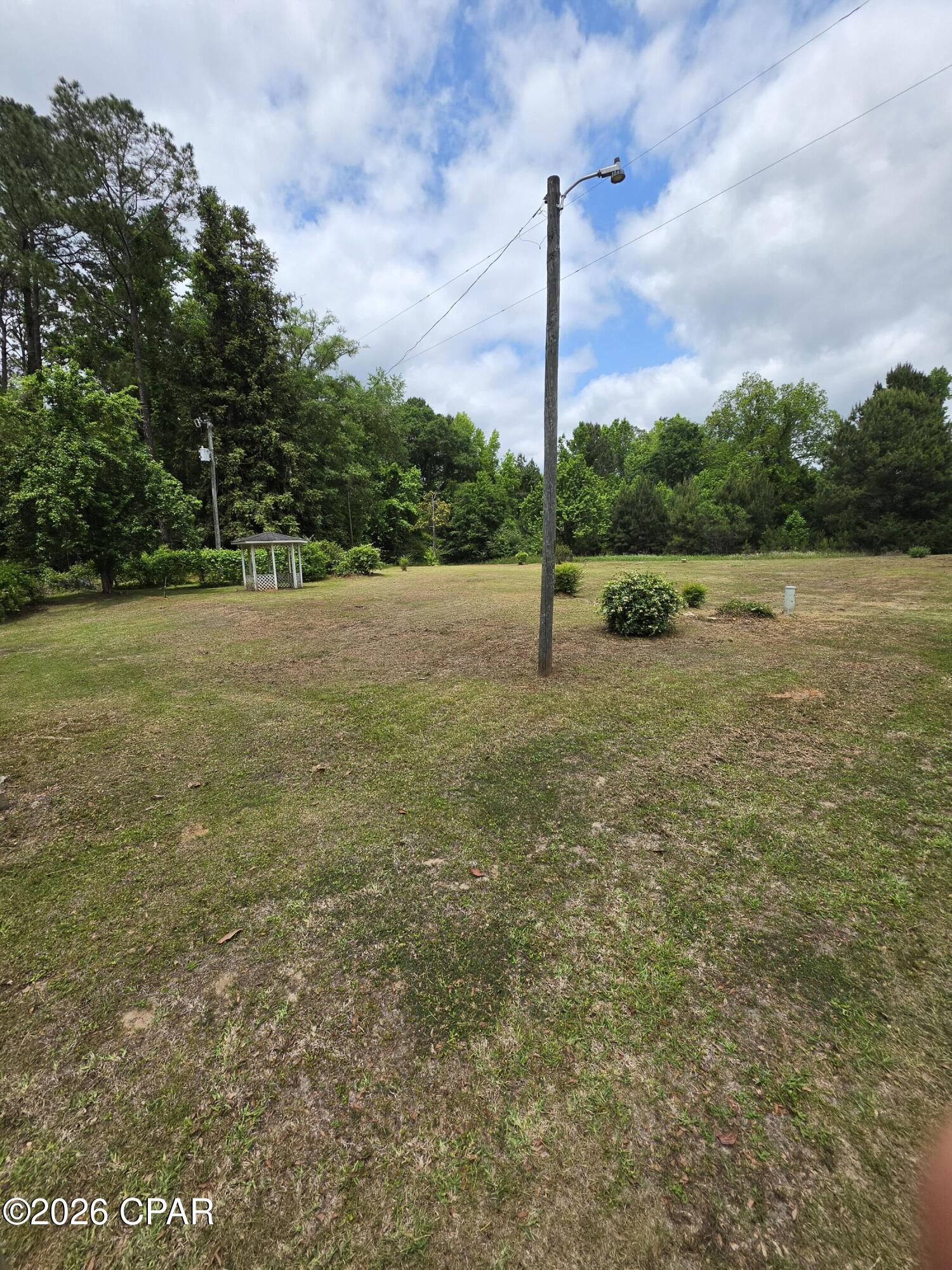 Nice piece of land with 270ft on Hwy 81. Previously a home site and appears to have a well that needs a pump and possibly a septic tank. Fruit trees and grape vines. A gazebo and a small shed. Up to buyer to do any and all due diligence. Lot is mostly cleared with grass. Priced to sell. Many possibilities with this piece.