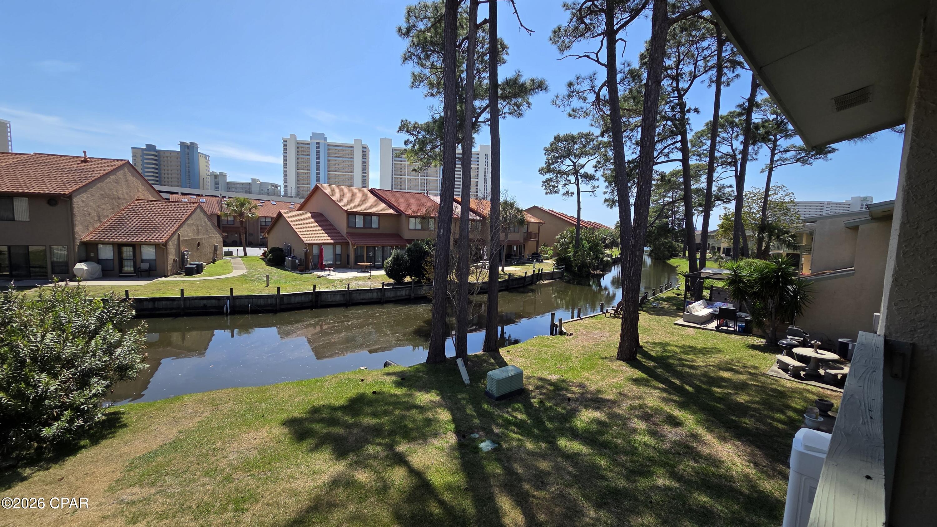 Located on a serene canal just steps from the white sands and crystal clear waters of the Gulf! This unique 2 bedroom 2 1/2 bath townhome has been completely renovated with wood grain tile flooring, updated kitchen, new appliances, updated bathrooms, and tasteful additions that are like no other in the resort. The continuous water heater saves on space and provides ample hot water for guests getting ready for an evening out after a long day on the beach! Corner unit with space to spread out and extra room for parking a golf cart! Gulf Highlands Resort features many amenities including 11 pools (5 heated in winter), pickleball, tennis, shuffleboard, 2 playgrounds, gym, and a beachside clubhouse with a restaurant and pool right on the sand! Grab this for your family vacations and let the rental income offset your expenses. At Gulf Highlands Beach Resort, every season is Beach Season!
Age, SF, and dimensions approximate.