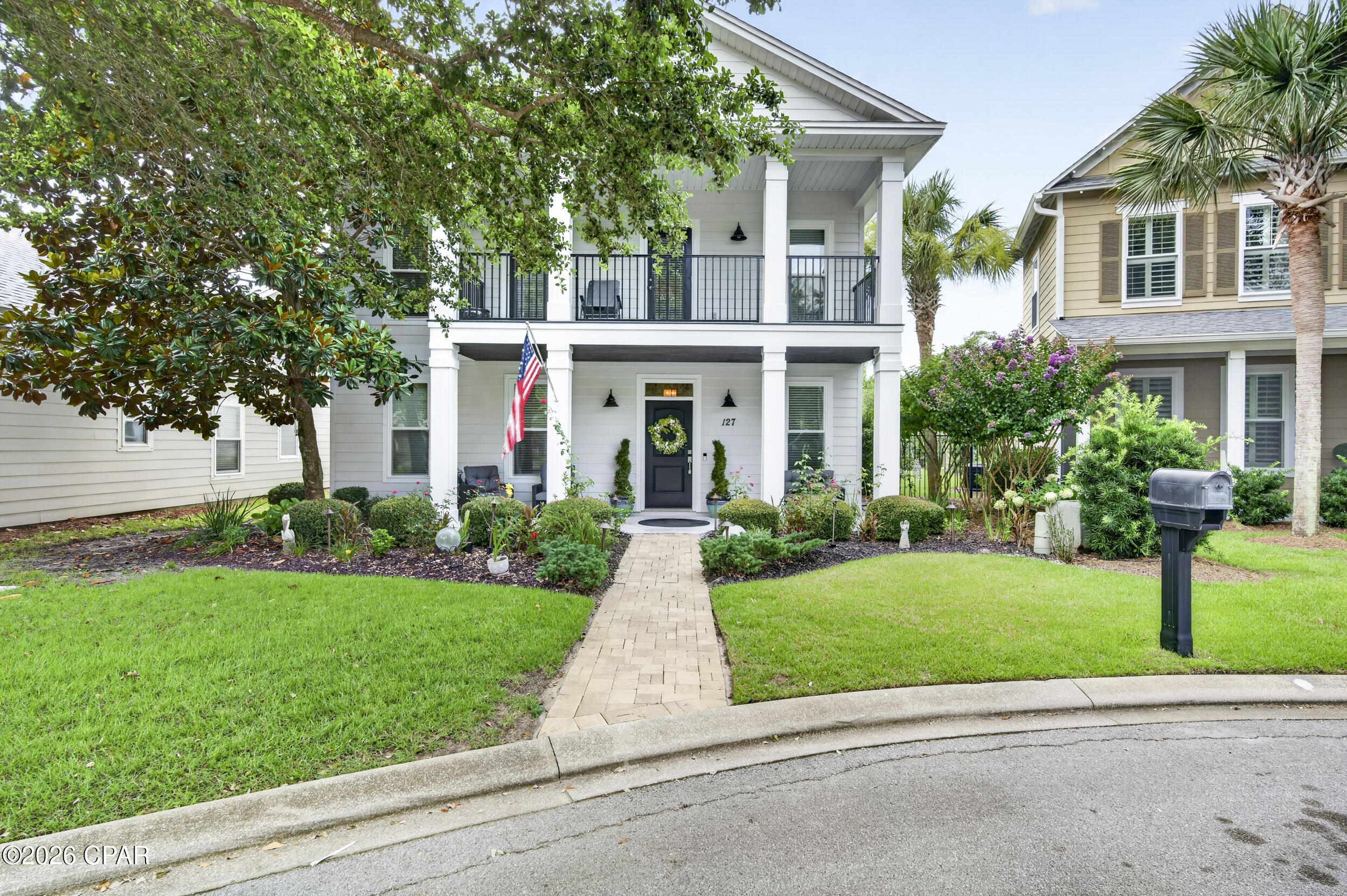 Where coastal charm meets everyday luxury, welcome to 127 Terrapin Close. Nestled in one of Panama City Beach's most desirable residential communities, this beautifully maintained 5-bedroom, 2.5-bath home offers over 2,400 square feet of thoughtfully designed living space just minutes from the area's sugar-white beaches, Pier Park, Frank Brown Park, and Northwest Florida Beaches International Airport. The open-concept floor plan seamlessly connects the living, dining, and kitchen areas, creating an inviting space for entertaining and everyday living. The updated kitchen features granite countertops and custom cabinetry, while the first-floor primary suite offers privacy and convenience. Upstairs, four additional bedrooms and a versatile loft provide flexibility for family, guests, a home office, or playroom. Enjoy your morning coffee on the screened porch or unwind on the balcony after a day at the beach. Oversized closets, a spacious two-car garage, and recent HVAC updates add comfort and peace of mind. Unlike many Panama City Beach communities, short-term rentals are prohibited, preserving the neighborhood's peaceful residential atmosphere. Residents also enjoy resort-style amenities including a community pool, clubhouse, pickleball and tennis courts, an amphitheater, and beautifully maintained common areas. This home offers the perfect blend of coastal living, modern comfort, and an exceptional location.