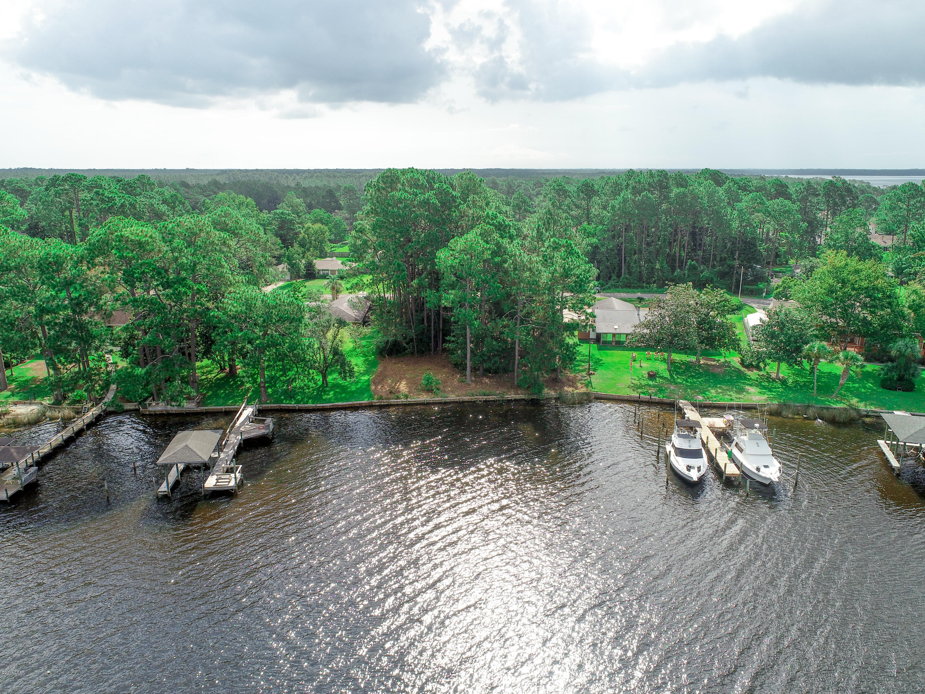 Waterfront lot in very desirable subdivision of Plantation Point. Lot is high and dry, has very good water 5-6 ft. 50 ft. out, good views, and a very well established neighborhood. Property also has an existing sea wall. Perfect location for your new waterfront home. Your five minutes to the Intercoastal Waterway, 20 minutes to Panama City, 25 minutes to the Gulf of Mexico. In the protected waters of Callaway Bayou. Looking for a building lot on the water, look no further.