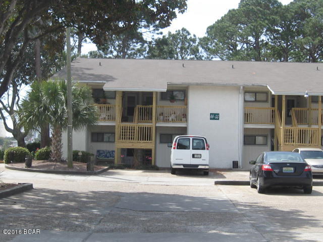 Great buy, this townhouse overlooks the lagoon ,You can set in living room and enjoy the view, offers a pier and Picnic  area out back and a beautiful back porch to enjoy setting out and watching the sun set. This is a  two bedrooms, two full baths  townhouse, this is HOA managed, Has swimming pool, tennis courts and private boat docs that can be rented. Being Sold as is ,This is a must see .