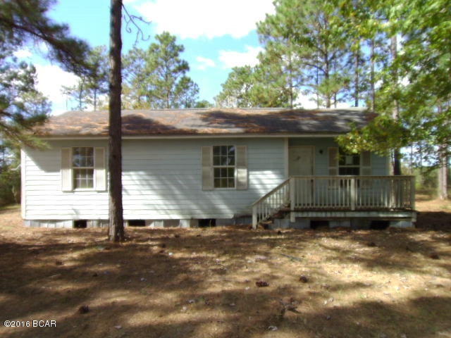 Home in the country on 9.1 acres! The land is nicely wooded and the house sits back off the highway. The location is great for easy access to Marianna, Altha, Blountstown and Panama City. The home has 3 bedrooms and 2 baths. The living, dining and kitchen area has open airy concept. There is a front deck and a rear deck. A great placed to enjoy nature.