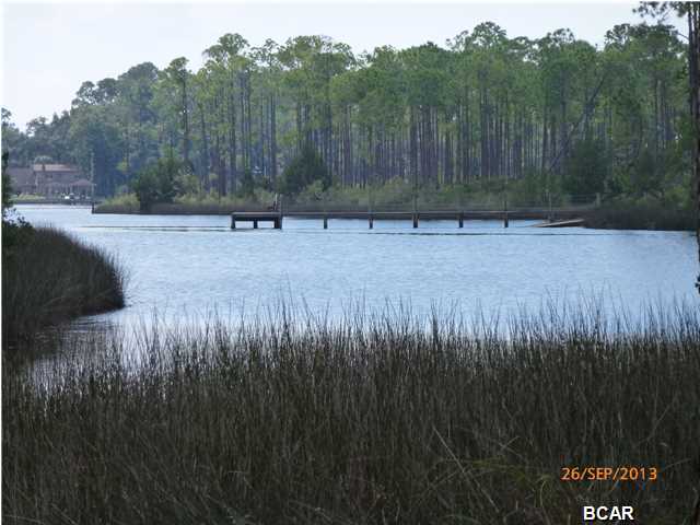Attention Bargain Hunters! Check out this 0.83 acre WATERFRONT lot in beautiful LAIRD BAYOU. Nice elevation and wonderful view across the bayou. Located on the E side of Panama City, convenient to town, shopping, churches, hospitals and recreation. The lot has been bush hogged and and can be walked from end to end. High and dry with a variety of shade trees. Laird Bayou is a gated waterfront community and is a perfect place for building your dream home. Construction of a private dock is prohibited on this lot, but the community has a private boat launch for access to East Bay and the Gulf of Mexico. There also is a community dock for fishing and a Gazebo to enjoy during the day or for watching the sun set over Laird Bayou. A securely fenced and gated storage area for RVs, boats or other toys is located a short distance from the boat launch. As a Laird Bayou home owner you also get to enjoy the community pool and bath house. This truly is a tranquil setting and you can enjoy watching a variety of local wildlife from deer and squirrels to birds and butterflies. Come home to Laird Bayou.