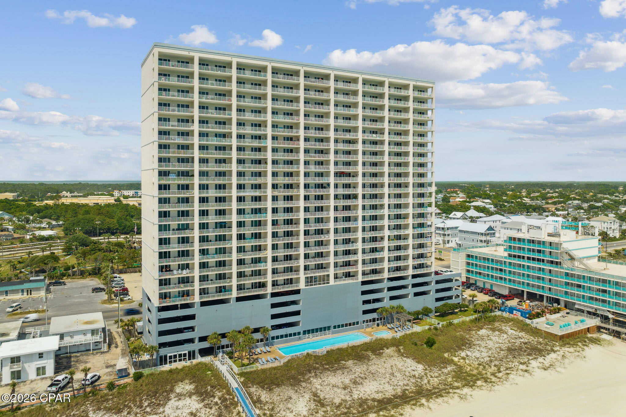 Ocean Reef 1308 - Gulf-Front Luxury in Panama City Beach.  Welcome to Ocean Reef 1308, a nicely  appointed 2-bedroom, 2-bath Gulf-front condominium offering breathtaking views of the emerald waters and sugar-white sands of Panama City Beach. Located in Ocean Reef Resort, this exceptional residence features a spacious 10' x 28' beach-front balcony perfect for sunbathing or enjoying meals and drinks while admiring the stunning sunsets and Gulf views.  Inside, you'll find an open-concept floor plan designed to maximize both comfort and scenery. Luxury vinyl plank flooring flows throughout the main living areas, while expansive sliding glass doors showcase spectacular Gulf views from the entryway, kitchen, dining area, living room, and primary suite.  The well-appointed kitchen features stainless steel appliances, tiled backsplash, breakfast bar seating, and custom designer light fixture. The Gulf-front primary suite offers private balcony access, a king-size bed, and ensuite bath with double vanity. A spacious guest bedroom easily accommodates two queen beds, making it ideal for family and guests. The guest bath provides private access to the guest bedroom and  accessibility to the main living area. Both bathrooms feature combination shower/tubs and are upgraded with stylish vanity countertops, mirrors, and fixtures. A separate laundry room includes washer, dryer, additional storage cabinetry, and wall hooks for beach gear and accessories.  Offered fully furnished and rental-ready, this turnkey property is an excellent opportunity for a vacation home, investment property, or full-time beachfront residence. You'll love the exclusive, assigned, parking space making parking a breeze.  Ocean Reef owners and guests enjoy outstanding resort amenities, including a Gulf-front outdoor pool and hot tub, indoor heated pool, steam room, sauna, fitness center, and outdoor grilling area.  Conveniently located near some of Panama City Beach's most popular attractions, you'll find Hidden Lagoon Mini Golf & Racetrack, Alvin's Island, and a local coffee and donut shop just across the street. Beachfront dining and cocktails await next door at Runaway Island.  Pier Park, located just 1.5 miles away, features premier shopping, dining, and entertainment including: The Grand 16 Theater, Topgolf, PCB SkyWheel, and new Pirates Voyage Dinner Show. Whether you're searching for an investment property or your own piece of paradise, Ocean Reef 1308 deserves a place at the top of your must-see list.  Buyer to verify all square footages and  room dimensions if important.
