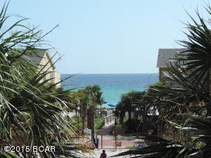 Largo Mar is on the quiet end of Thomas Drive.   Park in your assigned space which is directly in front of your condo and enter this beautiful condo home that has been updated in neutral tones.   18'' tile flooring from entrance patio to back patio.  The kitchen features new quartz countertops and the furnishings are contemporary.   This unit has a new central heating and cooling system with a transferable warranty.  All measurements approximate.  Please verify if important.