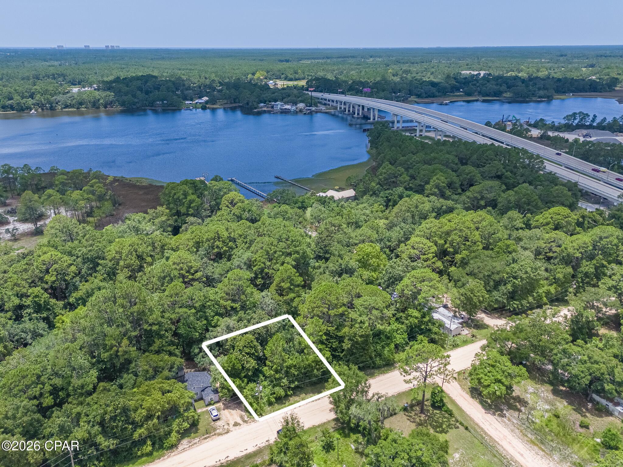 Discover the possibilities with this vacant homesite located just north of the West Bay Bridge in Panama City Beach. Ideally situated on the north side of the Intracoastal Waterway, this property offers a great location for those who enjoy boating, fishing, and the coastal lifestyle.
A public boat ramp is conveniently located on the south side of the West Bay Bridge, providing easy access to the Intracoastal Waterway, St. Andrews Bay, Shell Island, and the Gulf for a day of fishing or boating. Enjoy the convenience of being close to Pier Park, the Gulf beaches, Northwest Florida Beaches International Airport (ECP), and the area's continued growth and development.
Looking for additional space? The adjacent lot is also available for purchase, creating an excellent opportunity to own two side-by-side parcels for a larger homesite or future investment.
Buyer to verify all pertinent information, including lot dimensions, zoning, land use, utilities, environmental conditions, development potential, and any building requirements. All measurements are approximate and should be independently verified.