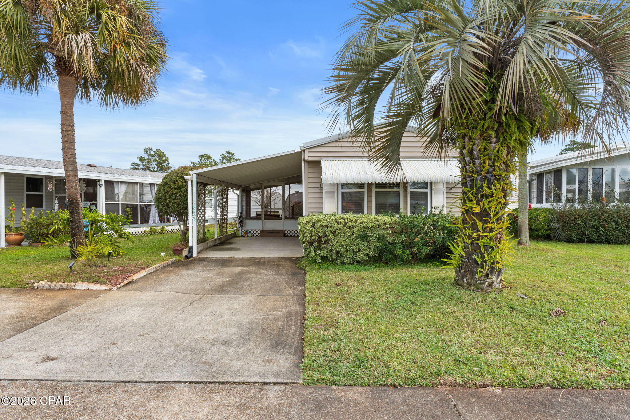CURRENTLY UNDER CONTRACT, SELLER WILL CONSIDER BACKUP OFFERS
Minutes to the Beach | 55+ Community Living. Enjoy easy Florida living just minutes from the beach (approx. 1.5 miles) in this spacious 3-bedroom, 2-bath home located in the desirable 55+ community of Greenwood Acres in Panama City Beach. 
Absolutely NO LOT RENT because you own the land! Offering one of the best values in the area, this property combines location, comfort, and low-maintenance convenience. Step inside to a bright and inviting living area filled with natural light and a functional layout ideal for everyday living. The primary suite features a private en-suite shower with a grab bar for added safety and convenience. Two additional bedrooms provide flexible space for guests, hobbies, or a home office. A welcoming front sunroom (not included in heated/cooled square footage) creates the perfect spot for morning coffee or a cozy sitting area.
Outside, enjoy the attached carport, deck area, and storage shed offering added convenience and extra storage space. Major updates include a metal roof (2017), windows (2017), and central AC with heat pump (2022), providing peace of mind for the next owner while still allowing opportunities to personalize the interior. Greenwood Acres is a well-kept resort-style community offering planned activities, a community pool, clubhouse, and gated RV/boat storage area. The HOA fee of only $287/month includes water, sewer, garbage service, lawn care, and Xfinity Wi-Fi and TV -- making this an excellent value for seasonal residents or full-time living. Conveniently located near shopping, dining, golf, and local attractions, this home offers a relaxed coastal lifestyle at an affordable price. Short-term rentals are not permitted, helping maintain the peaceful atmosphere of the community.
Priced to sell - schedule your showing today.