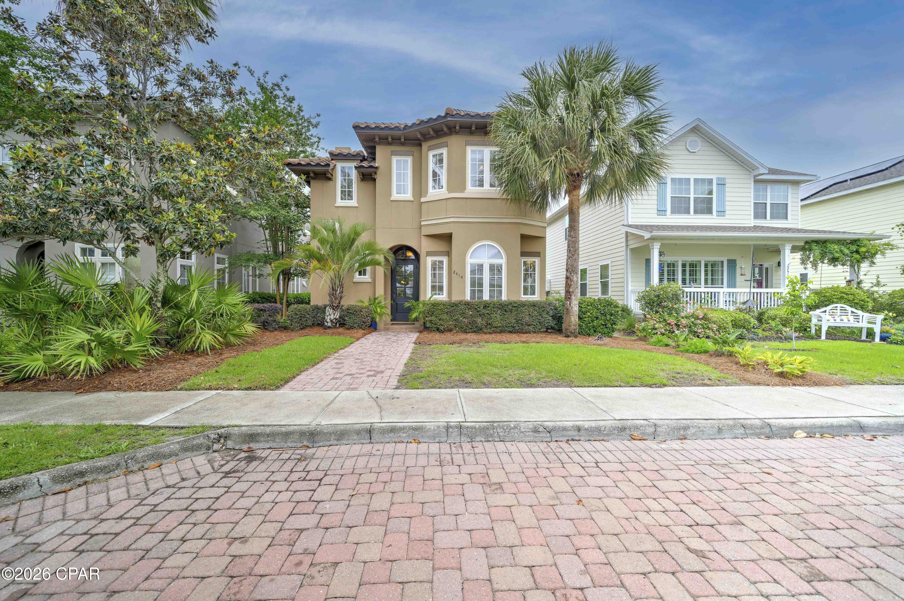 Welcome to this beautifully designed Tuscan-style home located in the gated bayfront community of Magnolia Bay Club in PCB!! This custom-built John Willis home, ''The Falcone,'' combines luxury finishes, thoughtful design, coastal convenience, and a 2 car garage!!!

This AMAZING home features travertine tile flooring, crown molding, 10-foot ceilings, 8-foot doors, granite countertops, custom cabinetry,  Bosch and LG stainless appliances, including a gas stove and wine cooler.....plus a paver driveway. The dining area seamlessly flows onto the covered back porch, creating an ideal space for outdoor gatherings and al fresco dining, The open-concept layout is perfect for entertaining, while the dual primary suite design provides flexibility and privacy.

Recent updates include a barrel tile roof  (60k!!), new carpet, updated kitchen appliances, polished and resealed travertine flooring, matching laundry room cabinetry, plus new commodes throughout. Washer & dryer convey.

  Indulge in the resort-style amenities, including a bayfront swimming pool, dining pavilion, gas grills, clubhouse with a fitness center, TV lounge, and billiards/ping pong. Children will enjoy the playground, while outdoor enthusiasts can explore the community dock and private beach with a kayak launch for owners -- all conveniently located near shopping, dining, marinas, St. Andrews State Park, and the beautiful white sandy beaches of Panama City Beach.  Don't miss your chance to make this idyllic retreat your own. Schedule a private tour today! Buyers please verify all measurements.

Whether you're looking for a primary residence, vacation home, or investment opportunity, this exceptional property offers the best of coastal living.