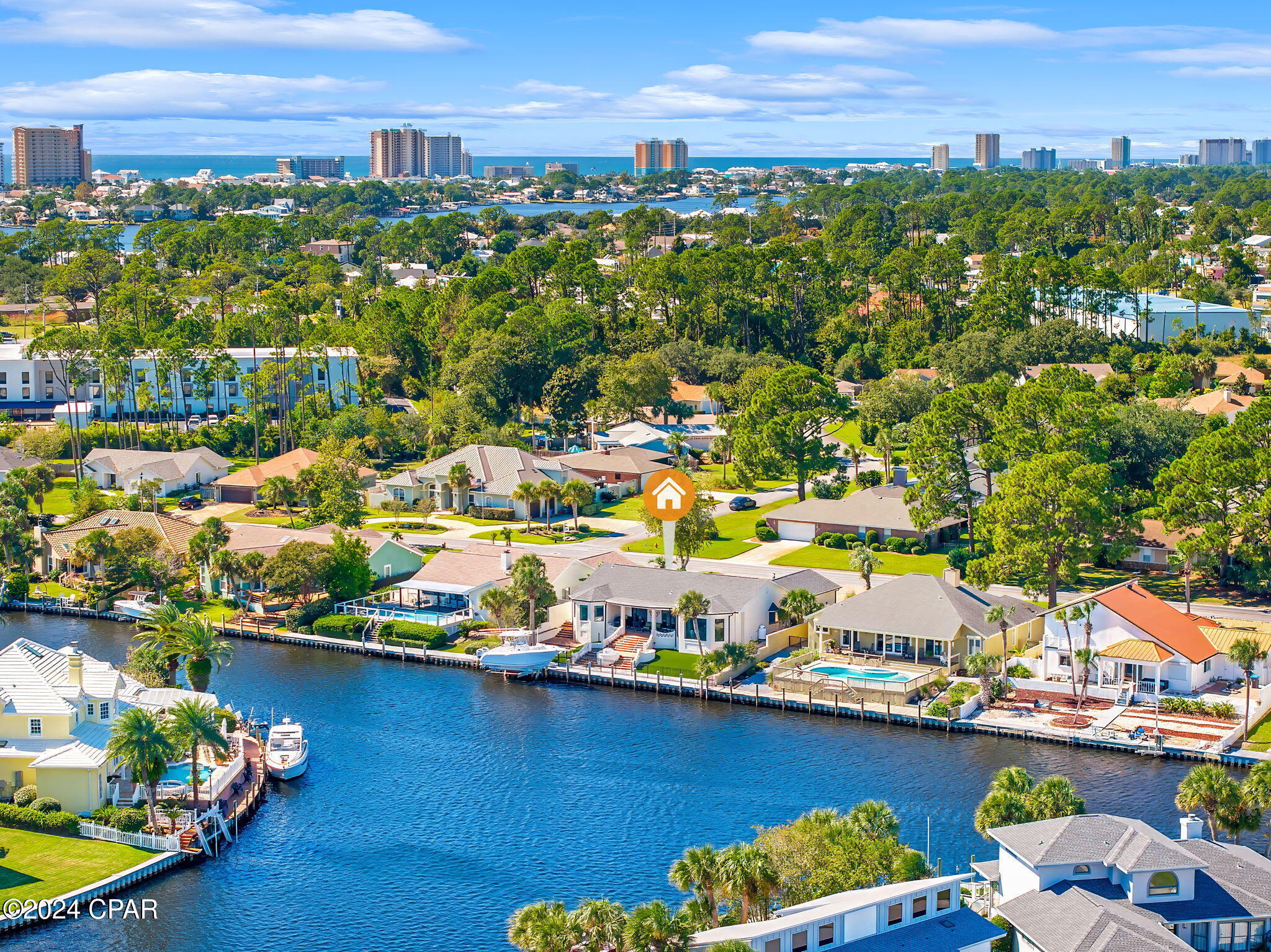 Discover waterfront luxury at its finest with this beautiful 3-bedroom, 2.5-bathroom home spanning 3,268 square feet in the prestigious Bay Point community. This residence is a boater's dream, offering a private dock and boat lift with direct access to North Lagoon and the Gulf of Mexico.

Step inside to an expansive, open-concept layout filled with natural light and floor-to-ceiling windows offering breathtaking water views. The spacious living area features custom shiplap walls, a sleek fireplace, and designer finishes throughout, creating a perfect blend of modern coastal elegance.
Entertain effortlessly in the gourmet kitchen featuring top-of-the-line stainless steel appliances, an oversized quartz island, custom cabinetry, and an adjacent wine bar with glass shelving and beautiful blue accents.
The master suite is a private retreat, complete with stunning water views, outdoor access, and a spa-like en-suite bathroom featuring dual vanities, a soaking tub, and custom cabinetry. Two additional generously sized bedrooms share a beautifully updated second bathroom.
Enjoy incredible waterfront sunsets from the expansive outdoor living area, complete with a fire pit and fountain, perfect for entertaining or relaxing after a day on the water. The private boat dock and lift make it easy to enjoy boating, fishing, and water sports right from your backyard.
The beautifully landscaped yard and large circular driveway offer impressive curb appeal and provide ample space for outdoor activities.
With a perfect combination of luxury, comfort, and waterfront lifestyle, this home offers everything you need for living the ultimate coastal dream. Don't miss your chance to make 443 Wahoo Road your own private paradise.