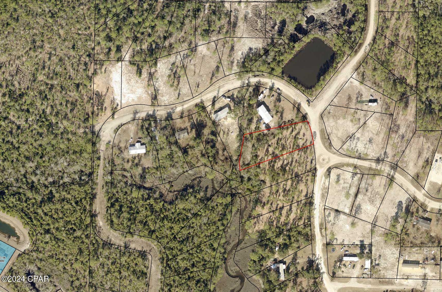 Lot 20A Hickory Bluff is a versatile vacant property near Fanning Bayou, ready for construction or a mobile home. No association fees, allowing for boat/RV storage or workshop. Surrounded by new homes, it offers a peaceful environment. Short drive to Lynn Haven, and the option to buy the adjacent lot or choose from multiple lots in Hickory Bluff community. Call for details.

All Information is deemed to be reliable, but is not guaranteed, buyer to verify if important.