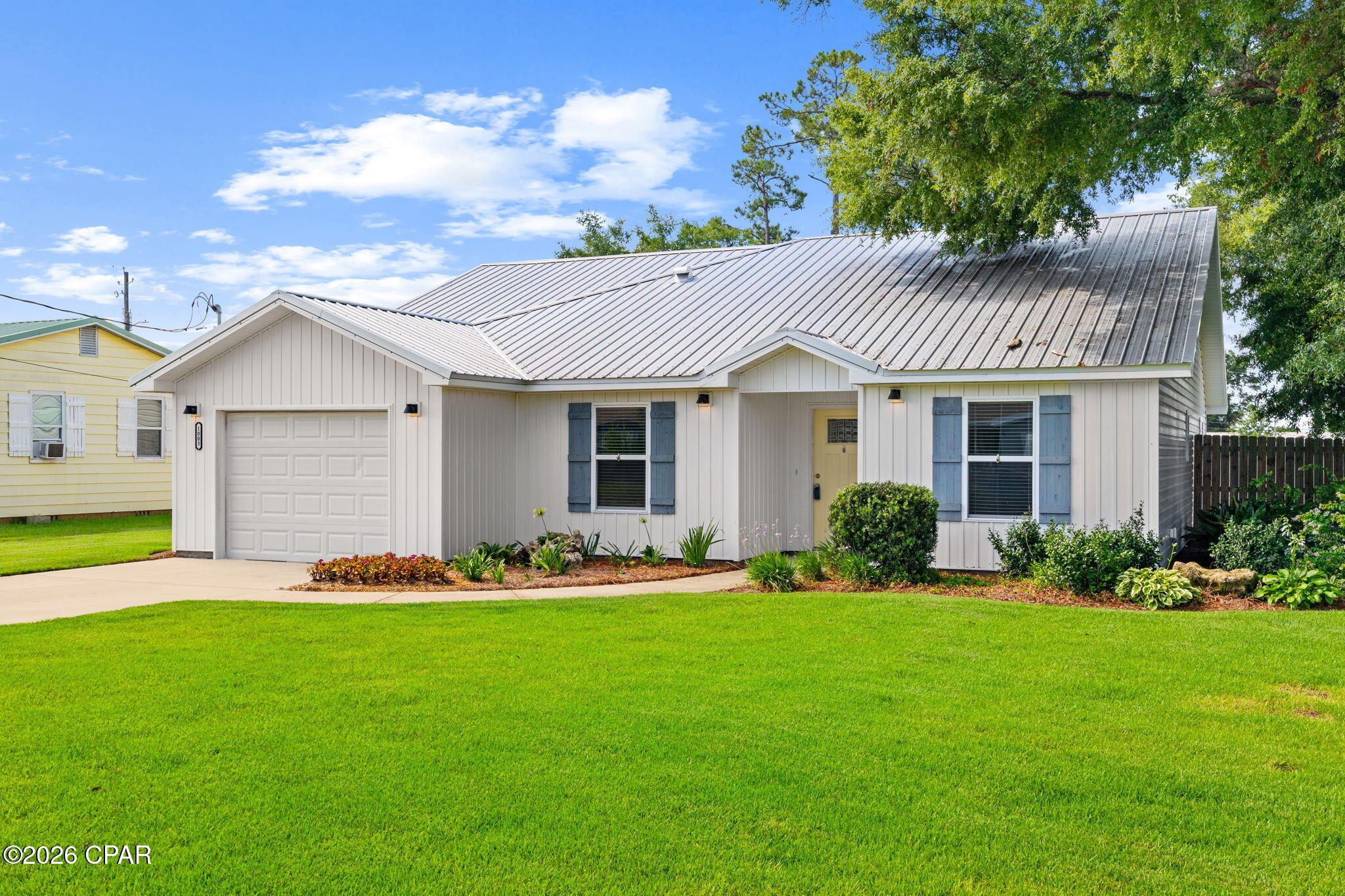 Lovely newer home in central location within short distance to Historic Downtown District,  Charming St. Andrews, the Government HUB of Panama City, Great Restaurants and Entertainment Venues. The exterior features  Board and Batten Siding with Coastal Style Shutters. Beautiful Professional Landscaping with a Privacy Fenced Back Yard. A covered entrance leads to an inviting Open Floor Plan featuring 9 ft ceilings and 10 ft decorative trays, maximizing the square footage! A Spacious Modern Kitchen with loads of storage,  features Stainless Appliances and White Quartz Countertops. The Living Area Opens to a Screened Porch to enjoy Florida Living Year Round! Hardiboard exterior and Metal Roof offer years of low maintenance living. Come take a look and love where you live!